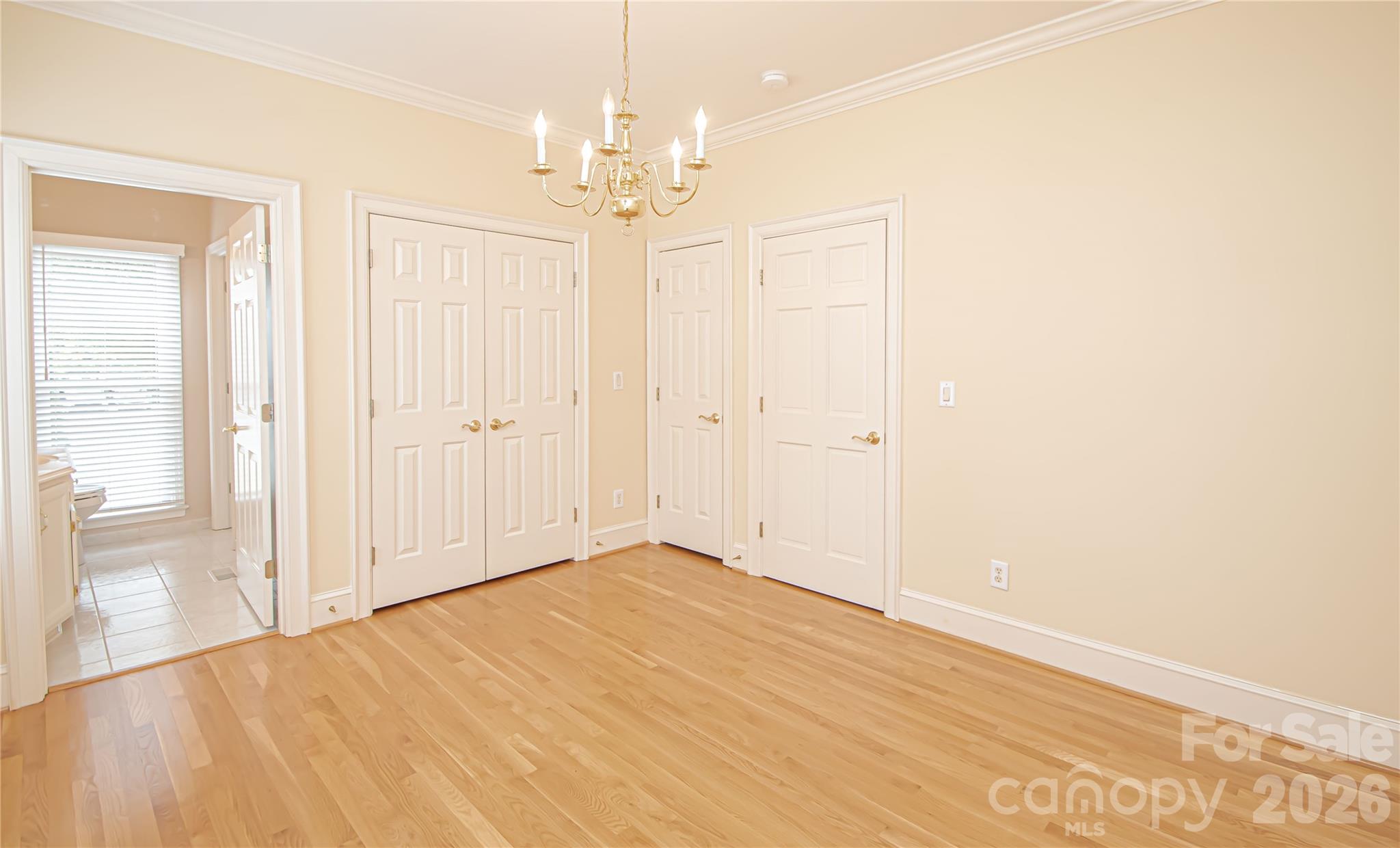 CORNER BEDROOM 12'x13' with HALF BATH en suite that connects to the shared shower. Fresh paint 9/26, new smoke detector 9/26, New Blinds, Two convenient deep closets, crown molding, chandelier with medallion base also pre wired for a future ceiling fan. - 5480 Glen Forest Drive, Charlotte