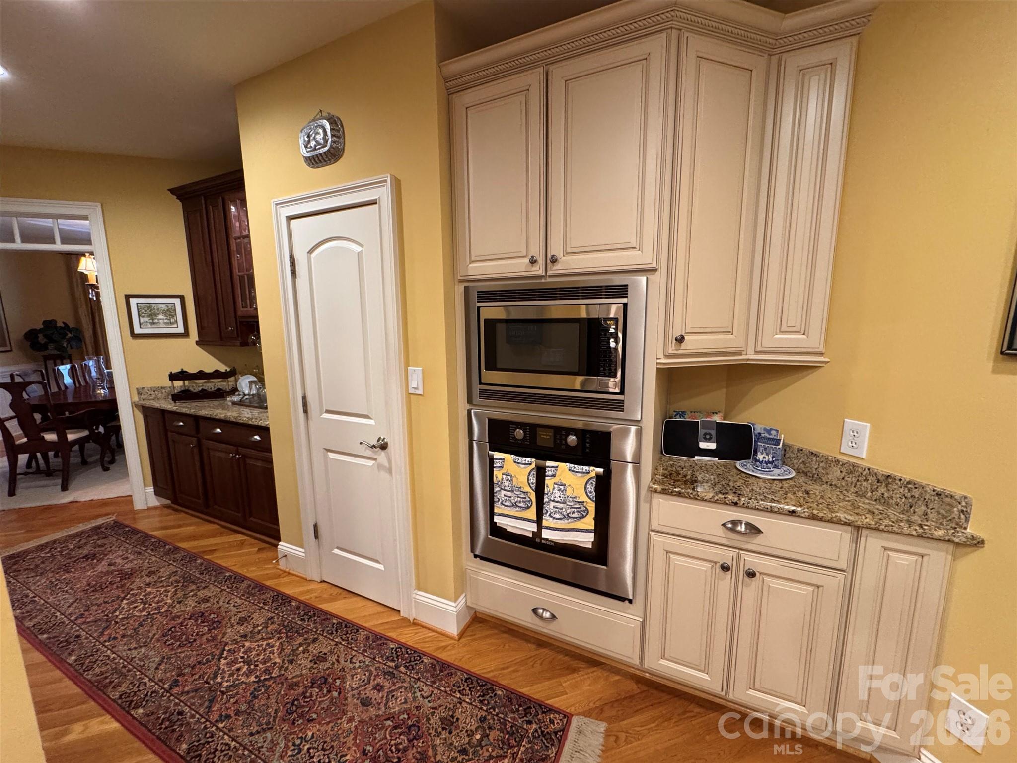 Butlers pantry/bar, Pantry, built in microwave/wall oven and additional countertop space for serving - 2909 Donegal Drive, Kannapolis