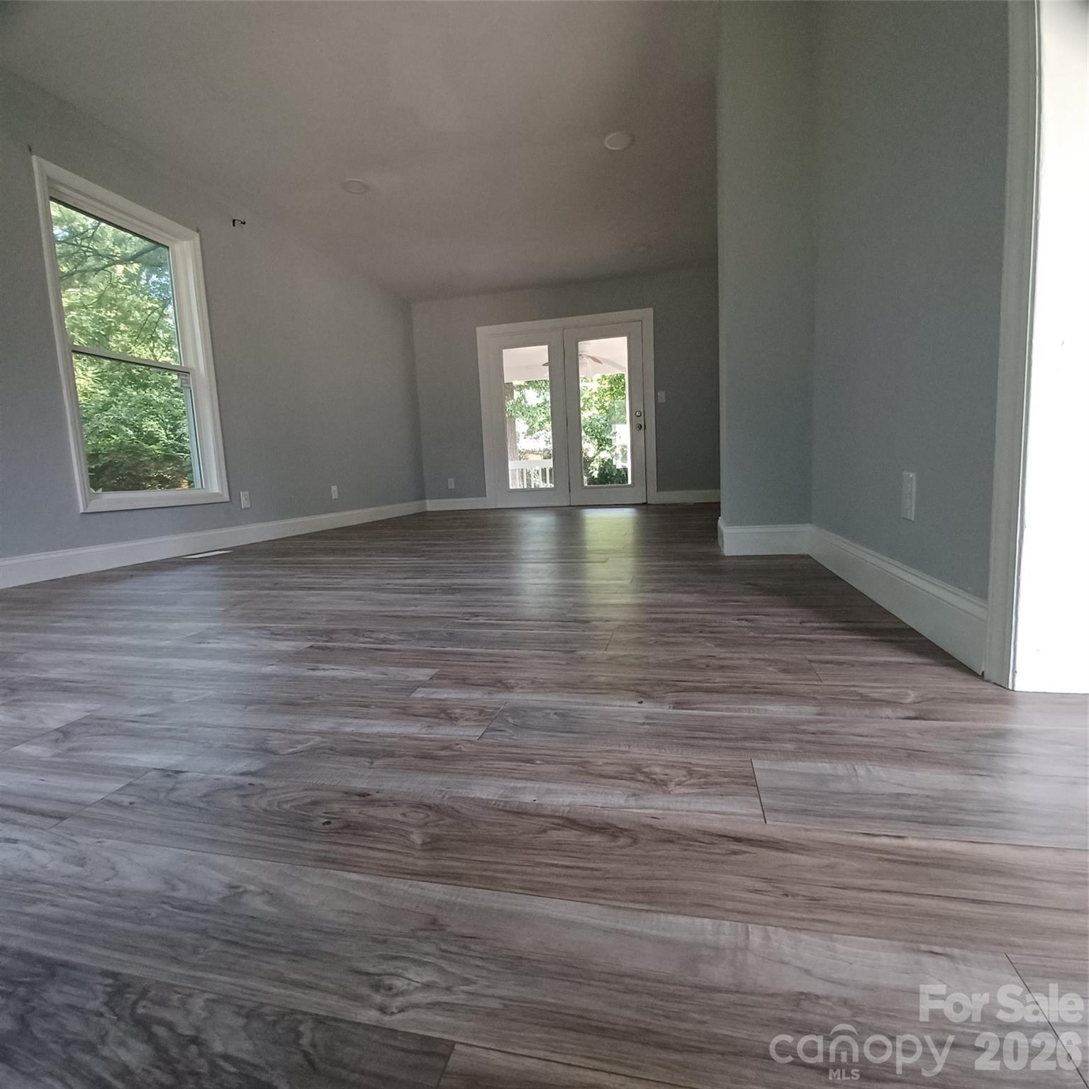 Family Room measuring 12 x 24 leading to 8 x 12 covered porch with french doors - 5717 Ruth Drive, Charlotte