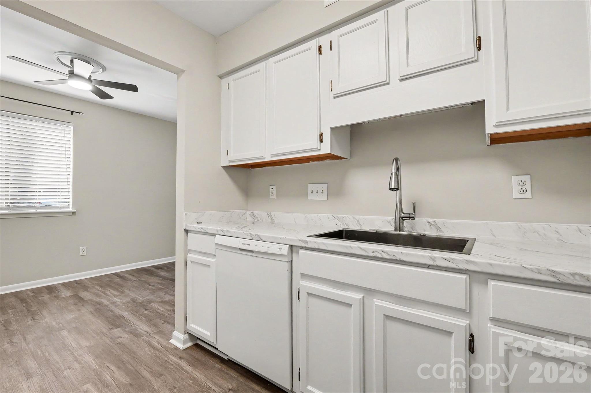 SASSY WHITE KITCHEN, NEW COUNTERTOPS, FAUCET WITH BLACK STAINLESS SINK - 3201 Heathstead Place, Charlotte