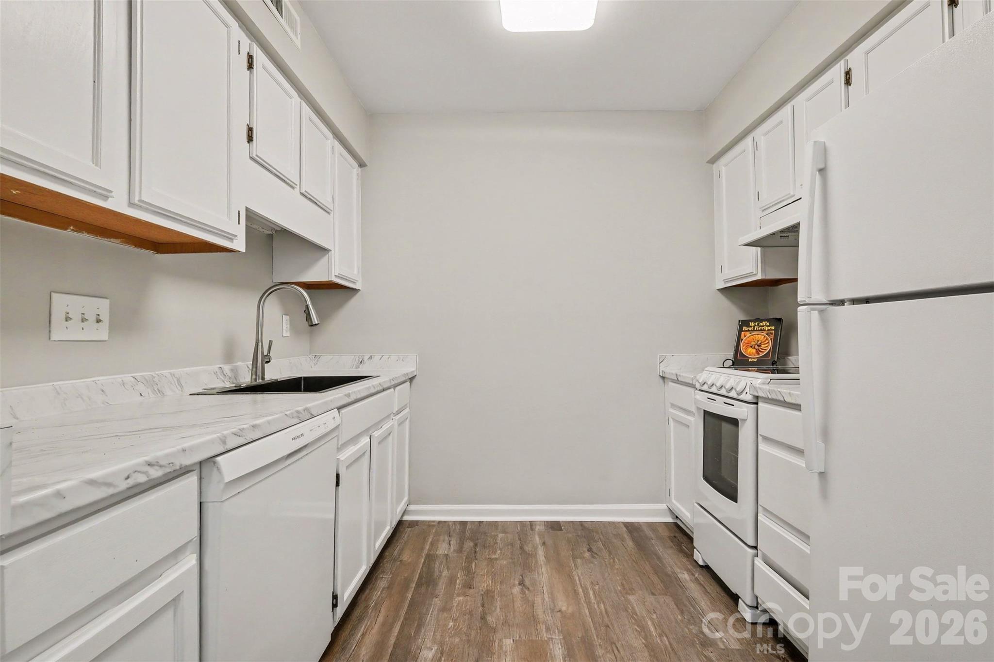 RENOVATED GALLEY KITCHEN - 3201 Heathstead Place, Charlotte