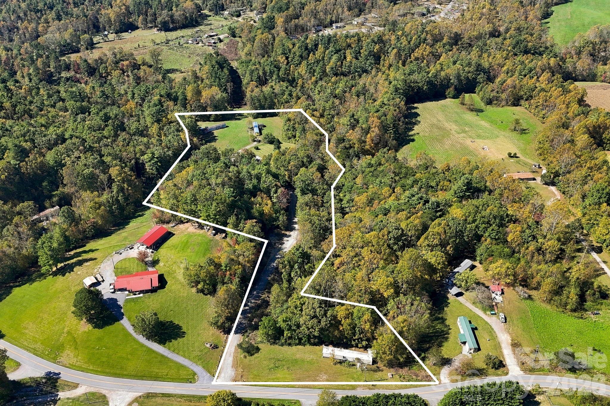 Approximate boundaries showcase the combination of existing homesites, mature woodland, and paved road frontage. - 631 Union Hill Road, Hendersonville