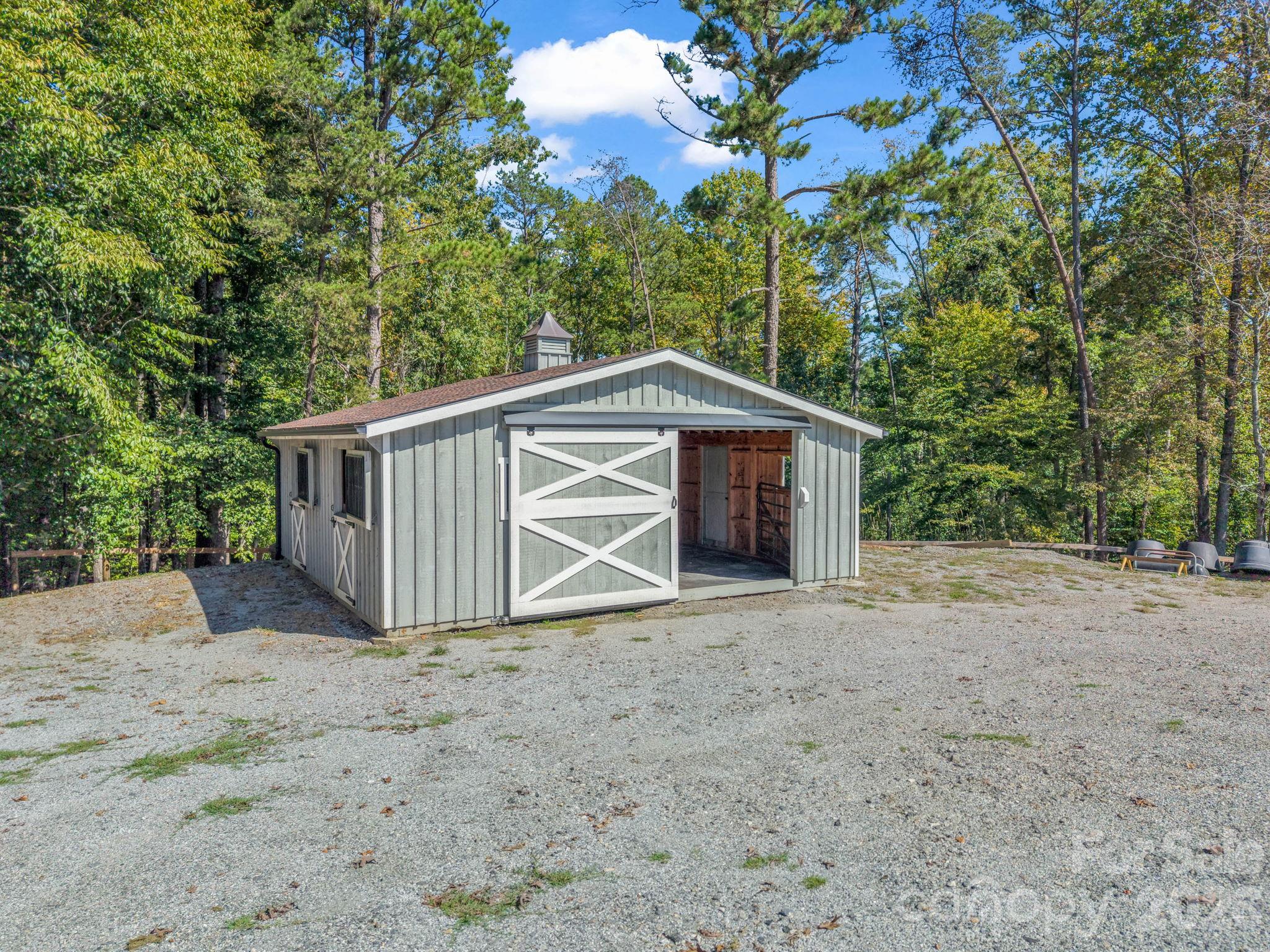 Two Stall Barn includes a Storage Area. - 401 Over Hill Drive, Tryon