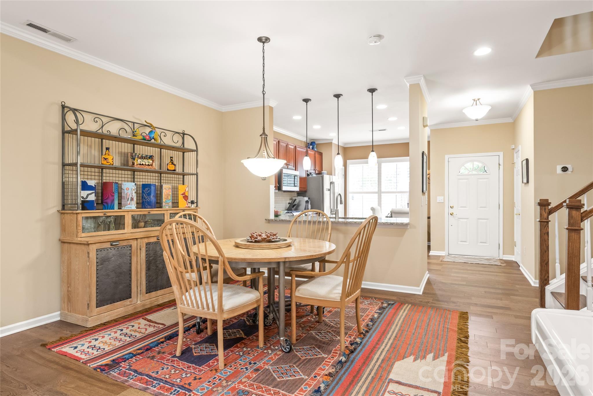 The open dining area sits right off the kitchen, making everyday meals and entertaining guests smooth, social, and stylish. - 4780 Grier Farm Lane, Charlotte
