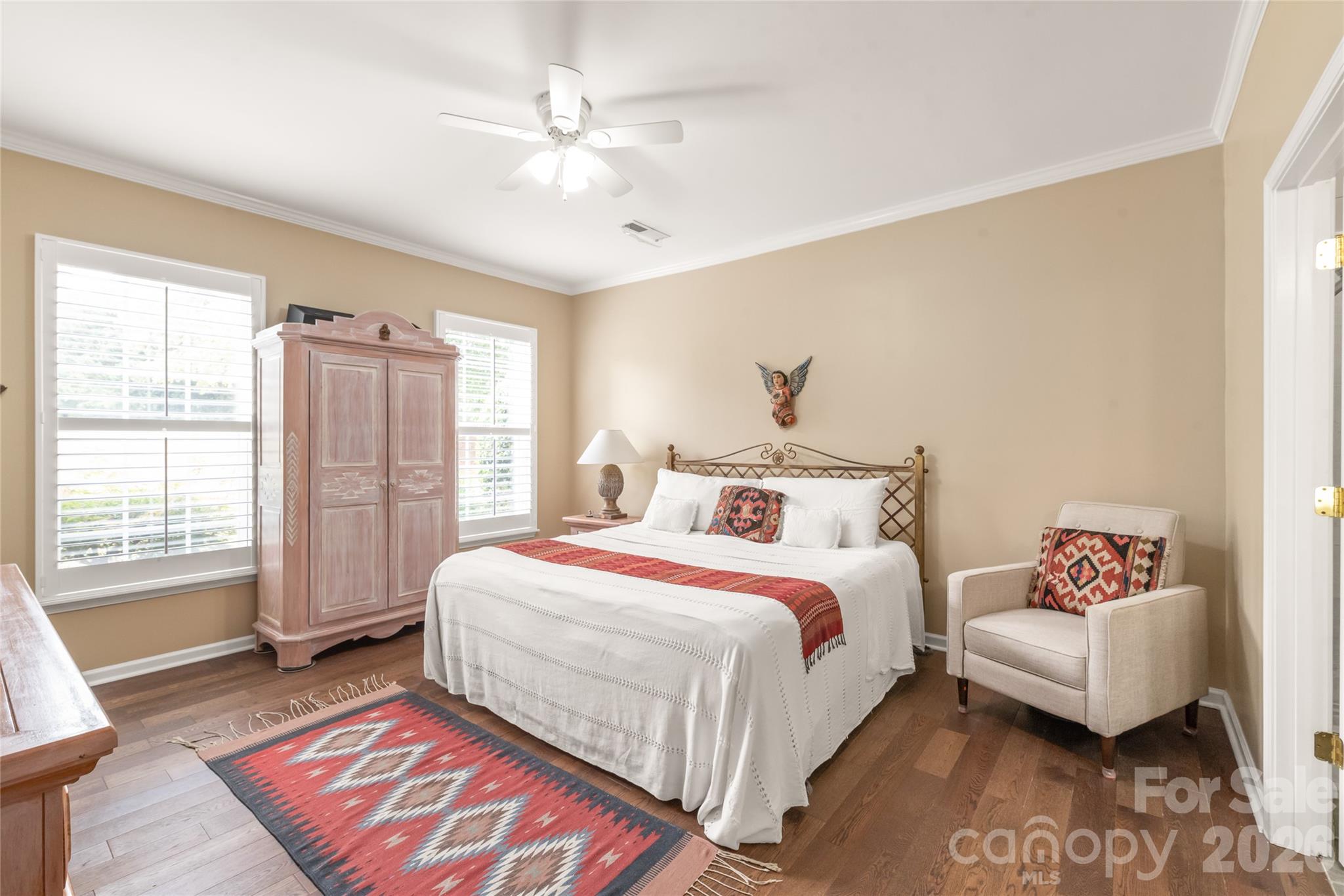 Primary Bedroom on Main Level: Thoughtfully positioned for convenient, main-floor living without compromising the flow or space of the primary living areas. - 4780 Grier Farm Lane, Charlotte