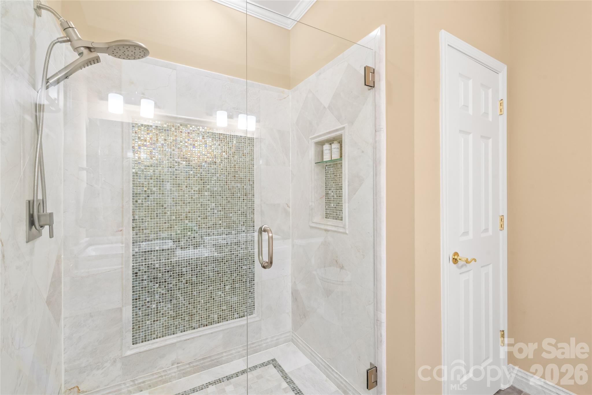 Bright, fresh, and beautifully appointed, this updated bathroom off the primary suite offers a clean, luxury experience right at home. - 4780 Grier Farm Lane, Charlotte