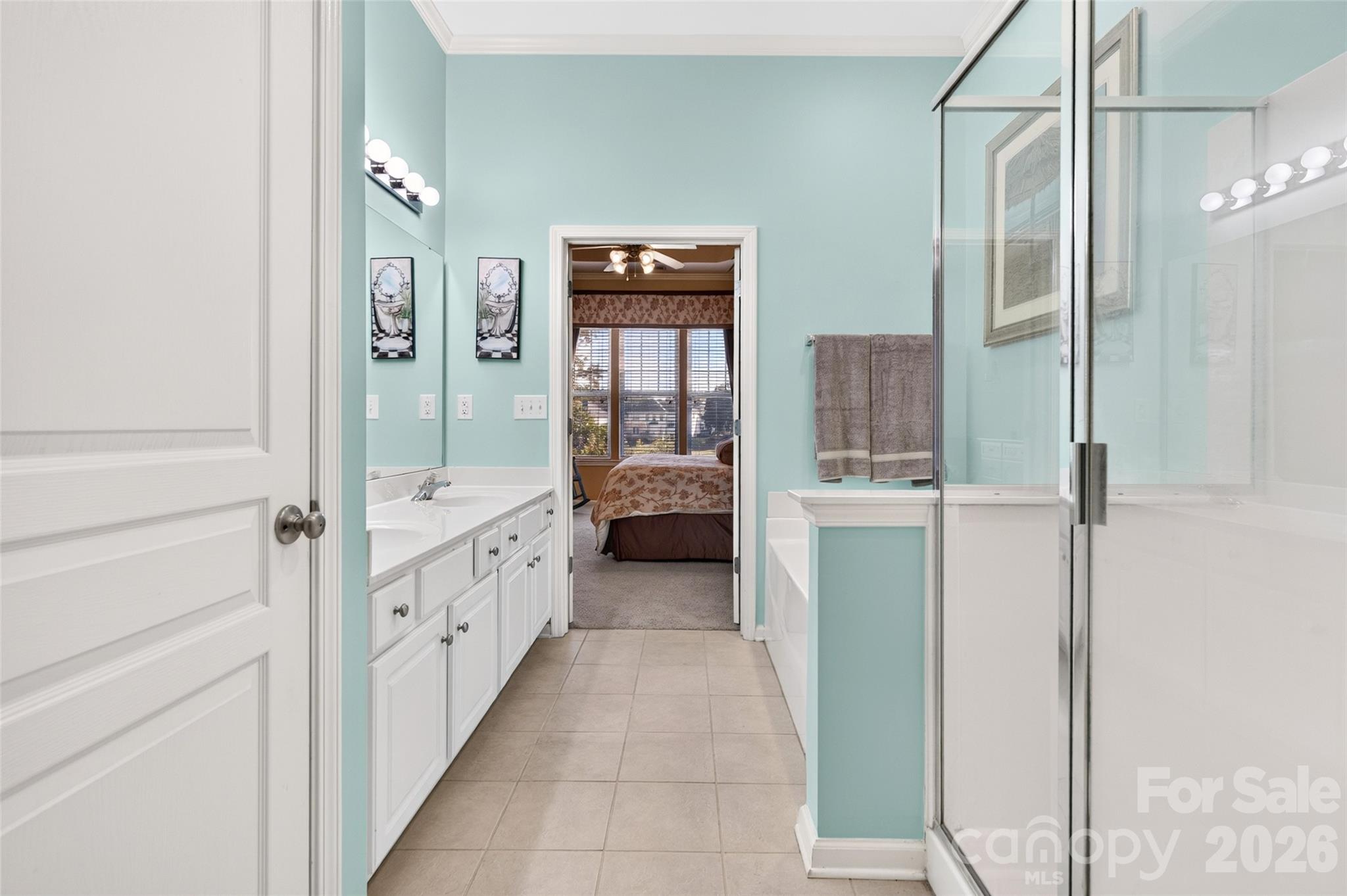 Primary bedroom's ensuite. Dual Sinks, separate shower and garden tub. - 8432 Brookings Drive, Charlotte