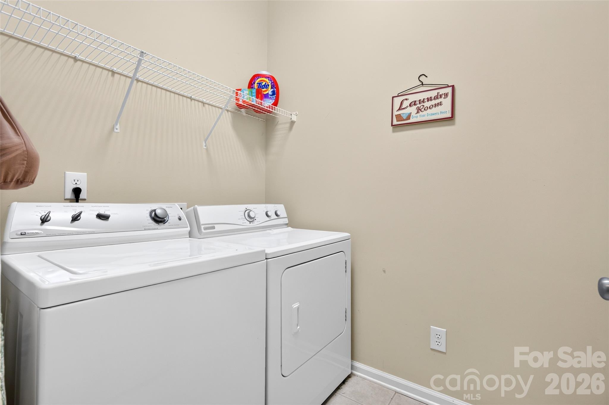 Laundry room with a shelve. - 8432 Brookings Drive, Charlotte