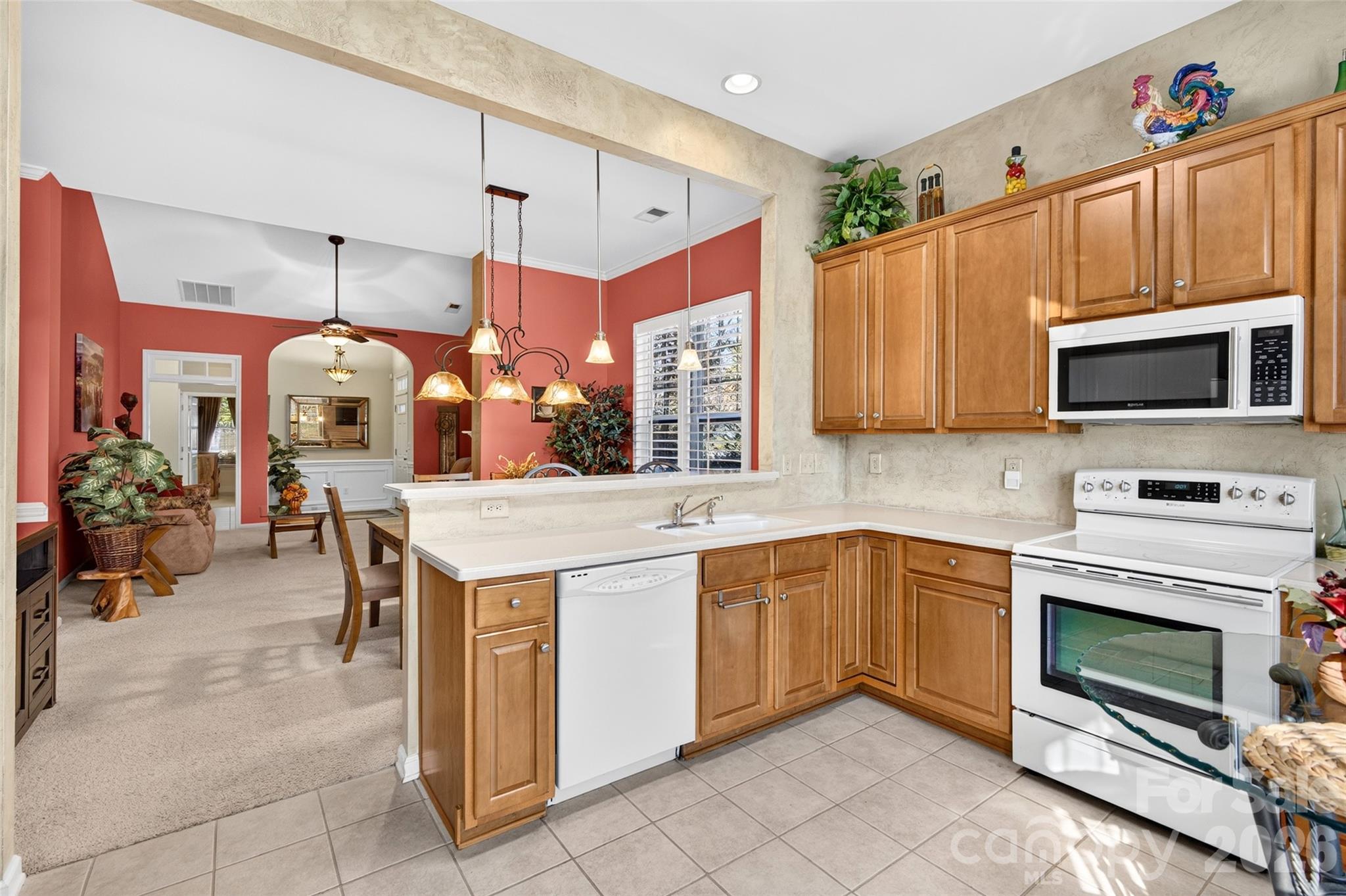 Chef's Kitchen with white appliances - 8432 Brookings Drive, Charlotte