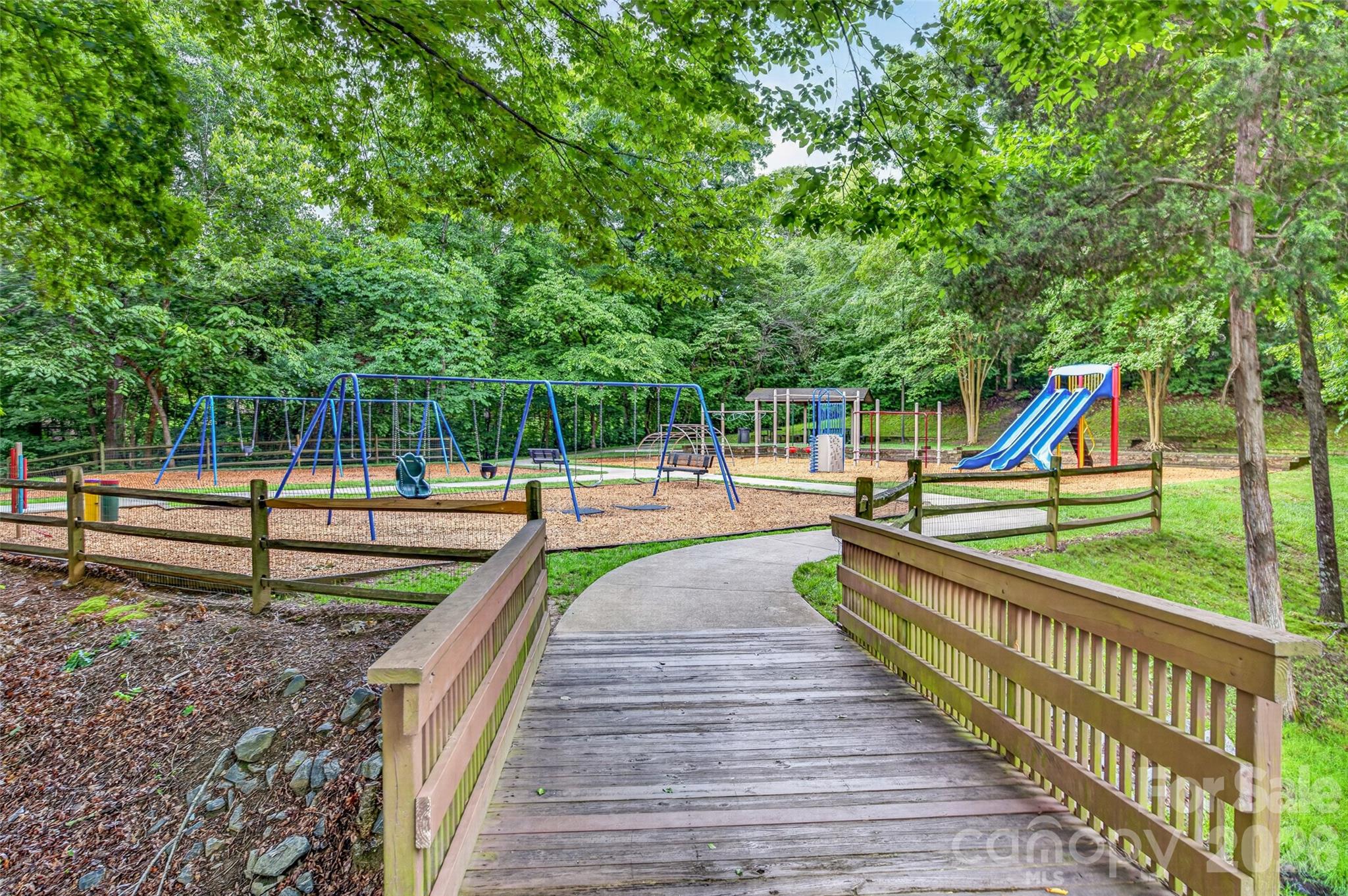 One of several walking trails and parks in Highland Creek Community. Sports Club Park's playground. - 8432 Brookings Drive, Charlotte