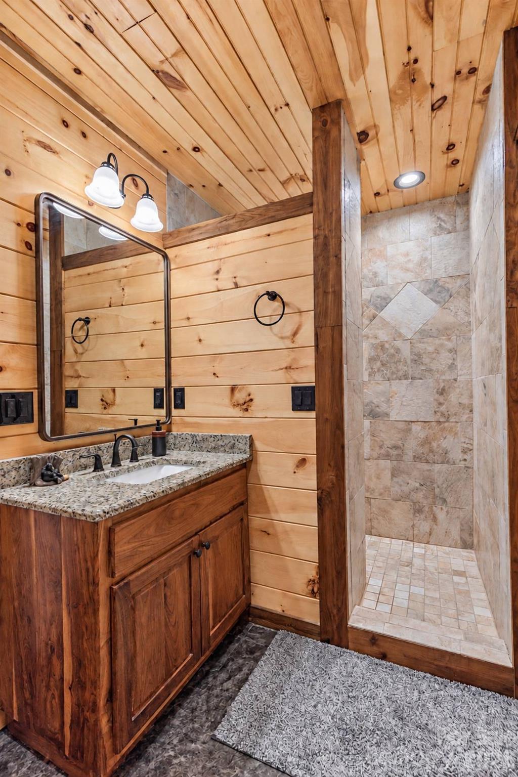 Primary bath vanity and walk-in shower - 18 Fairway Run, Bryson City