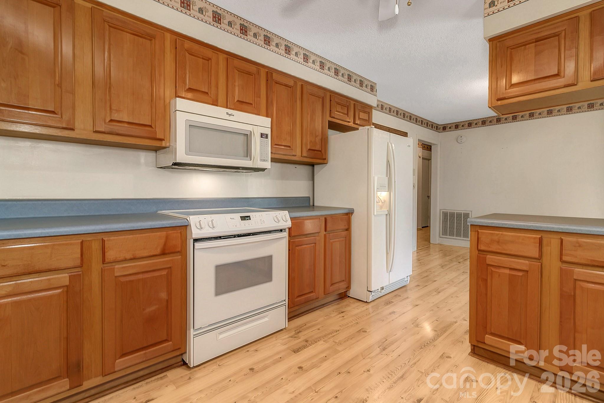 Kitchen view from laundry room - 1 Dewberry Drive, Hendersonville