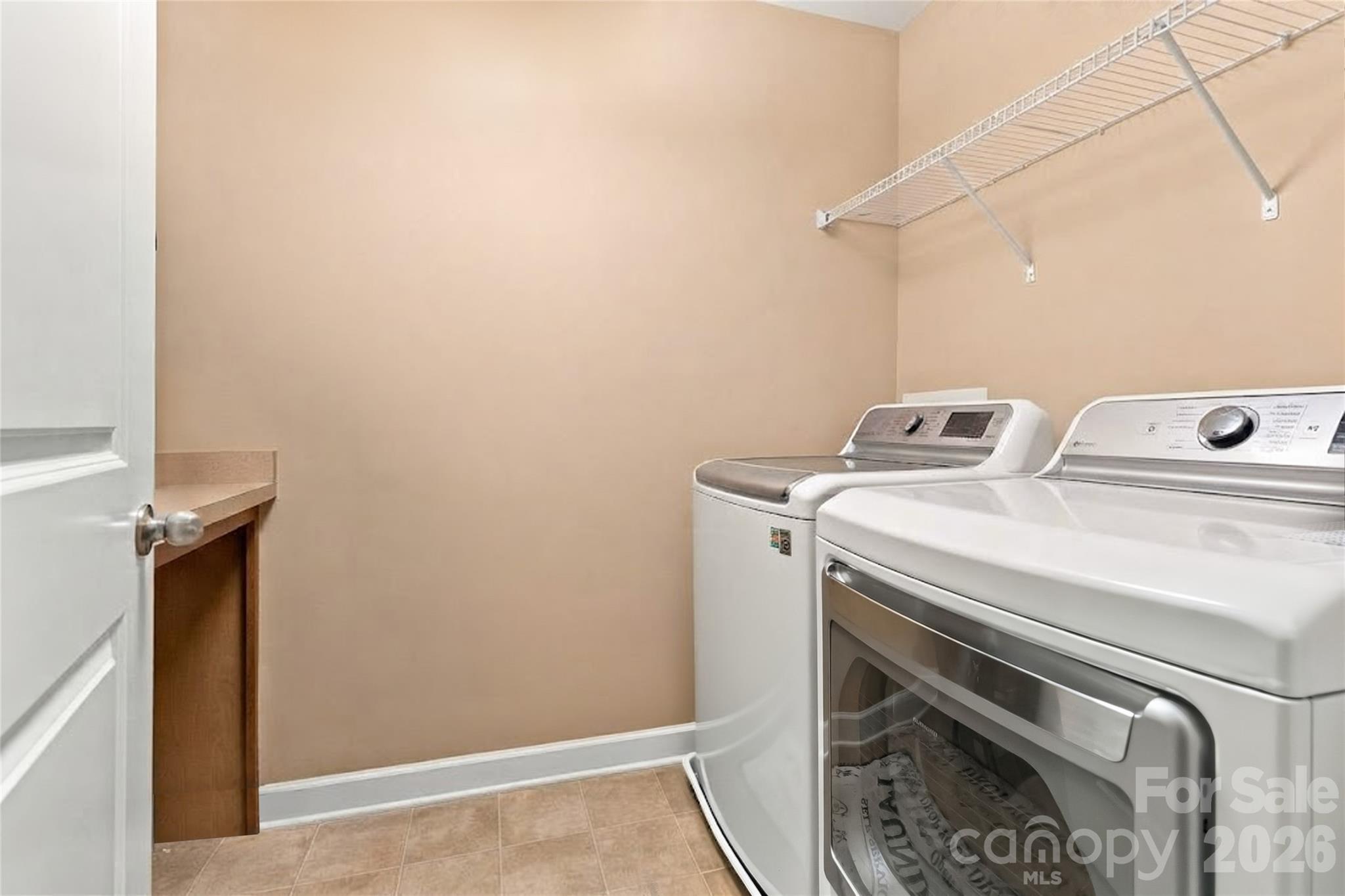 Laundry Room with folding table - 15221 Kissimmee Lane, Mint Hill