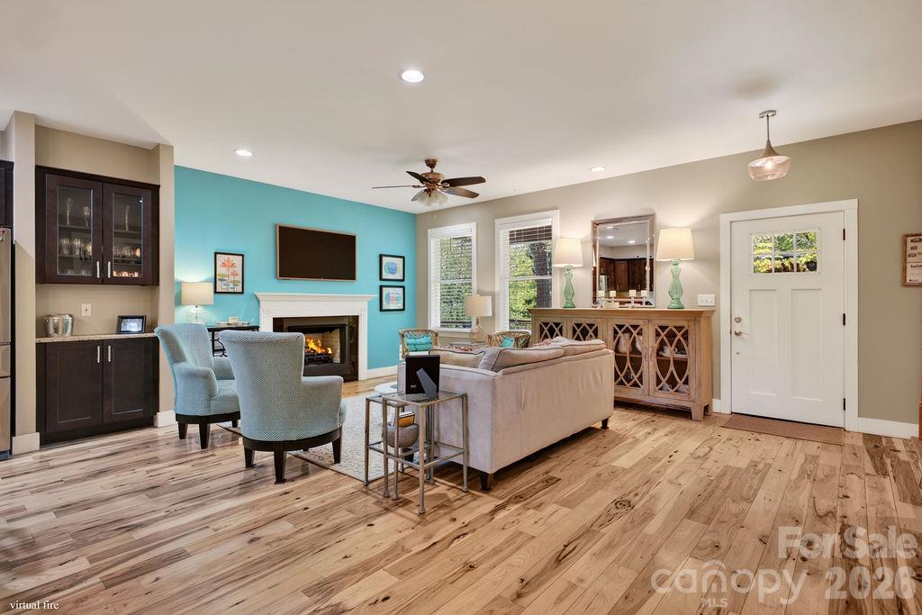 With an open floor plan there are a variety of ways furniture can be placed to make this living room suit different tastes and styles! - 98 Langwell Avenue, Asheville