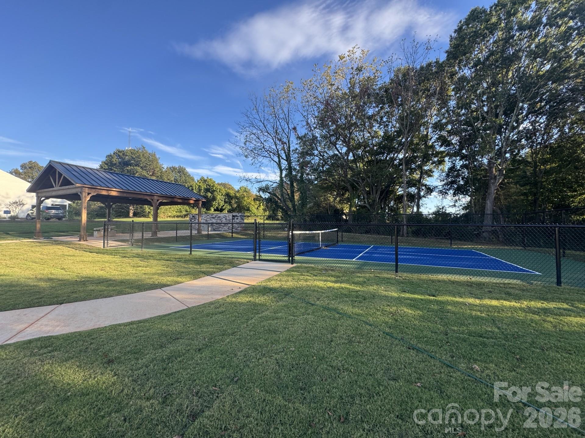 Pickleball Court, Covered Pavillion and outdoor seating area with gas fireplace - 208 Rodeo Drive, Shelby