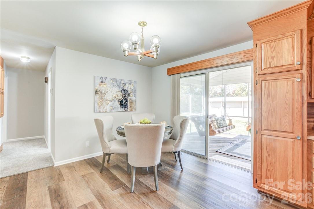 Dining area leads to large screened in porch - 311 Bell Road, Kings Mountain