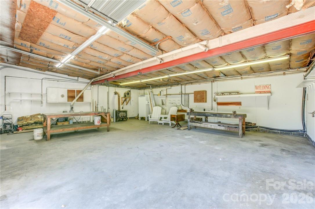 Garage is equipped with bathroom and wood-burning stove - 311 Bell Road, Kings Mountain