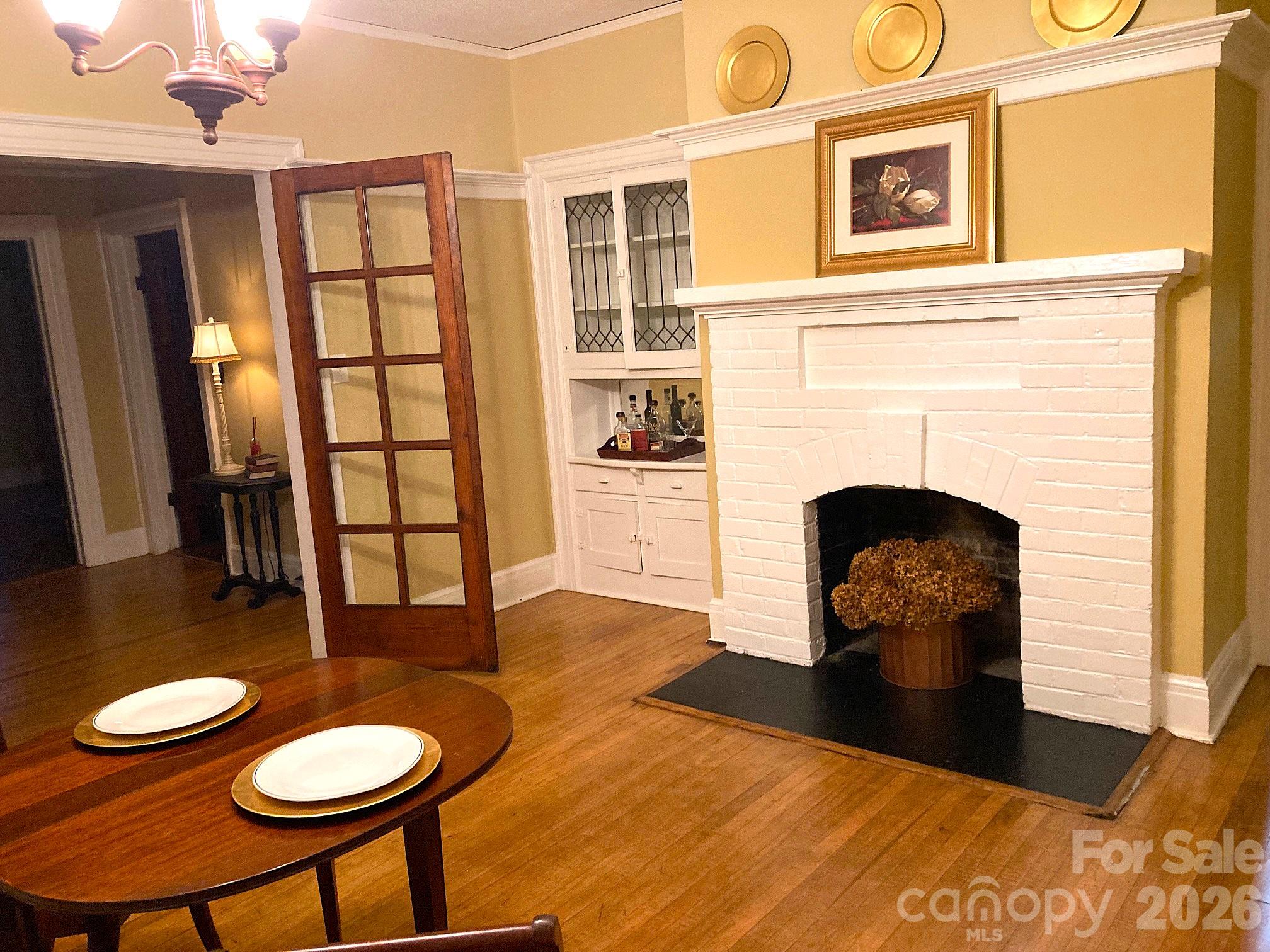 Dining Room with non-functioning fireplace. - 326 S 3rd Street, Albemarle