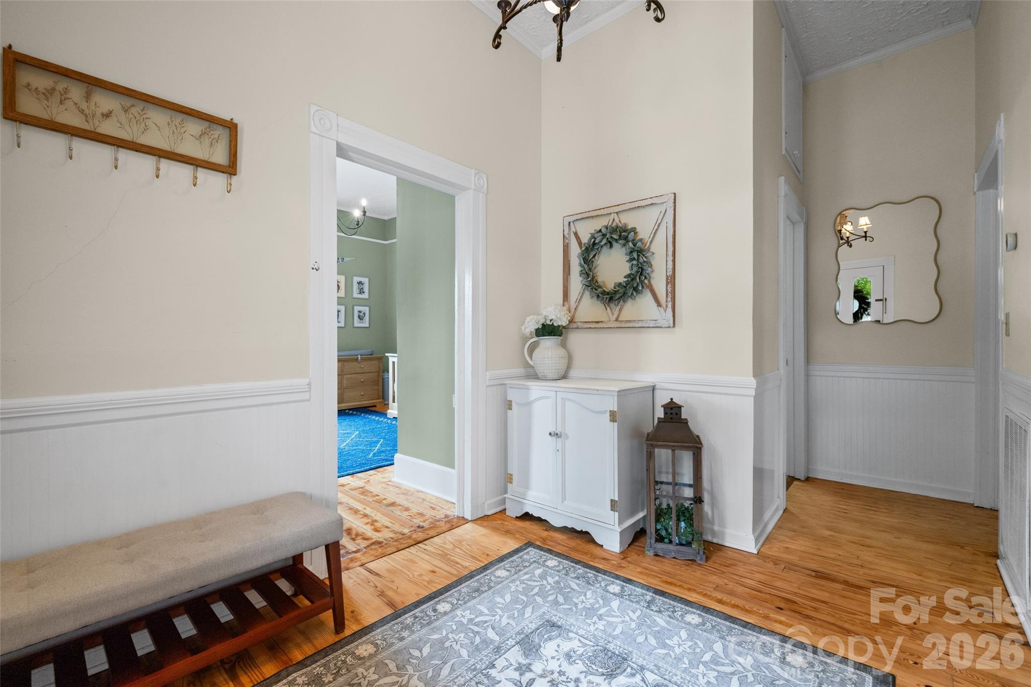 Another view highlighting the home's inviting entryway, hardwoods, and timeless details. - 231 E Jefferson Street, York