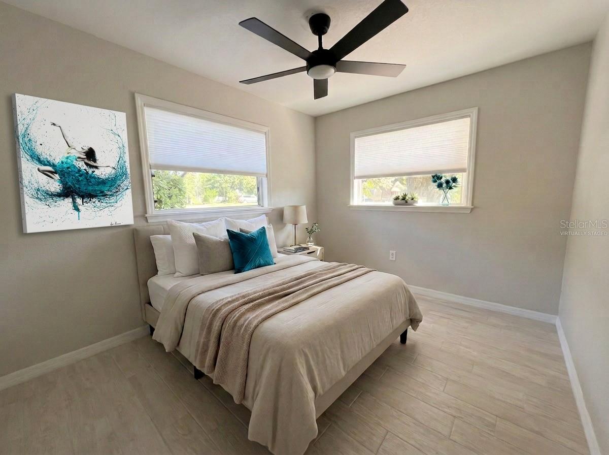 Bedroom 2. All new flooring—porcelain tile.Virtually Staged - 5131 BROOKMEADE DR, SARASOTA