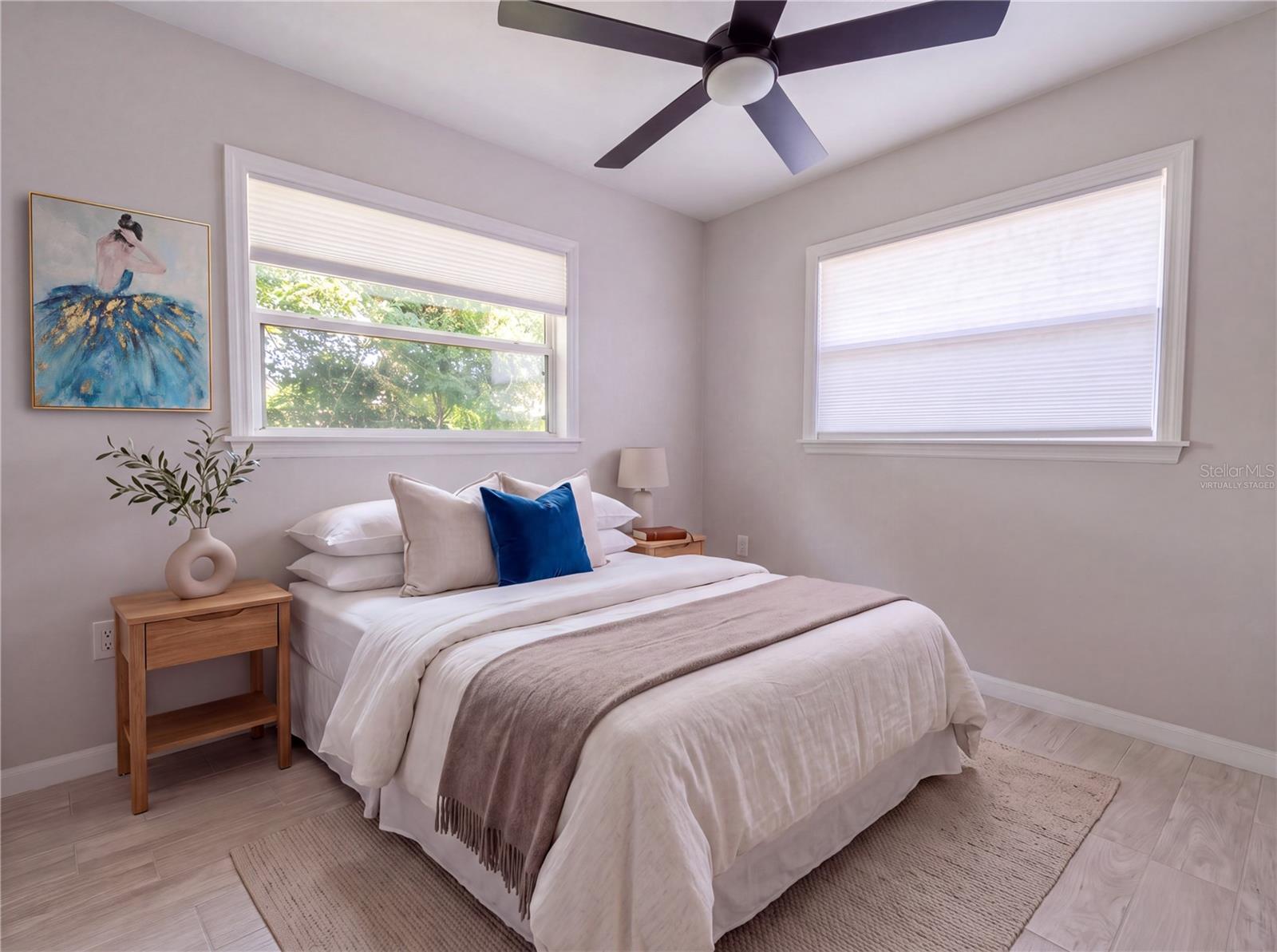 Bedroom 1. All new flooring—porcelain tile.Virtually Staged - 5131 BROOKMEADE DR, SARASOTA