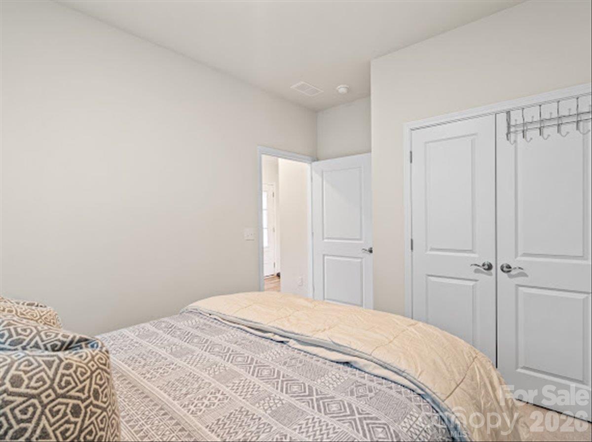 Spacious bedroom complete with ample storage space behind classic double closet doors. - 155 White Apple Way, Statesville