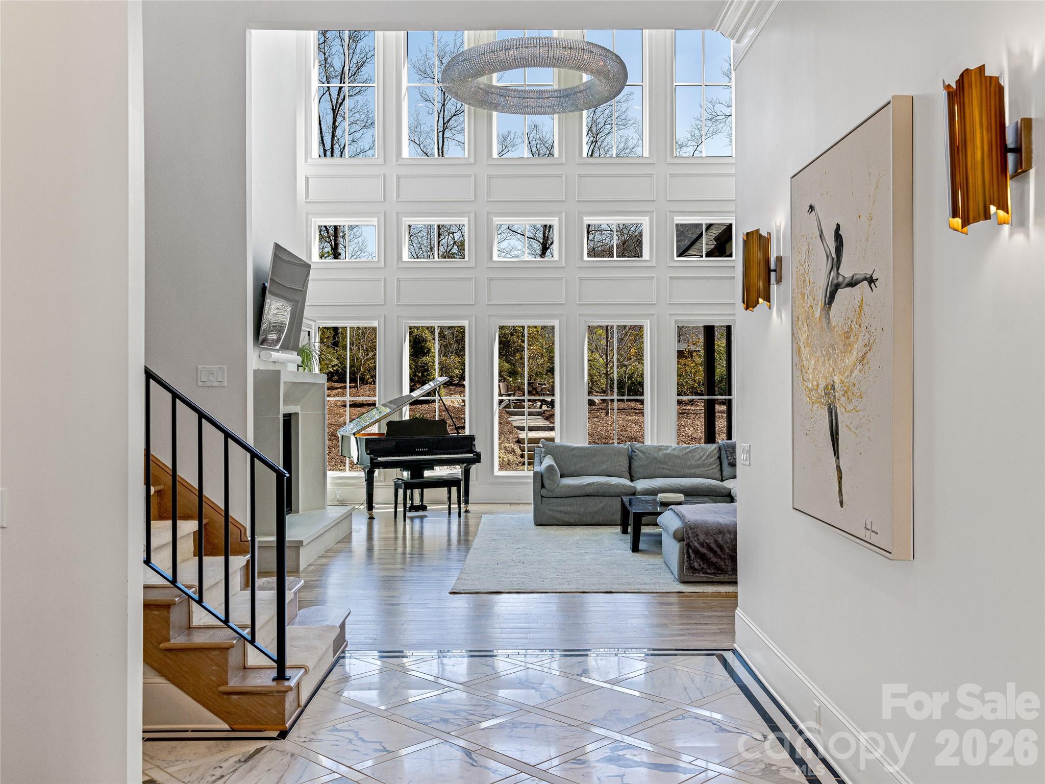Soaring windows in great room with custom lighting. - 1905 White Tree Trail, Arden