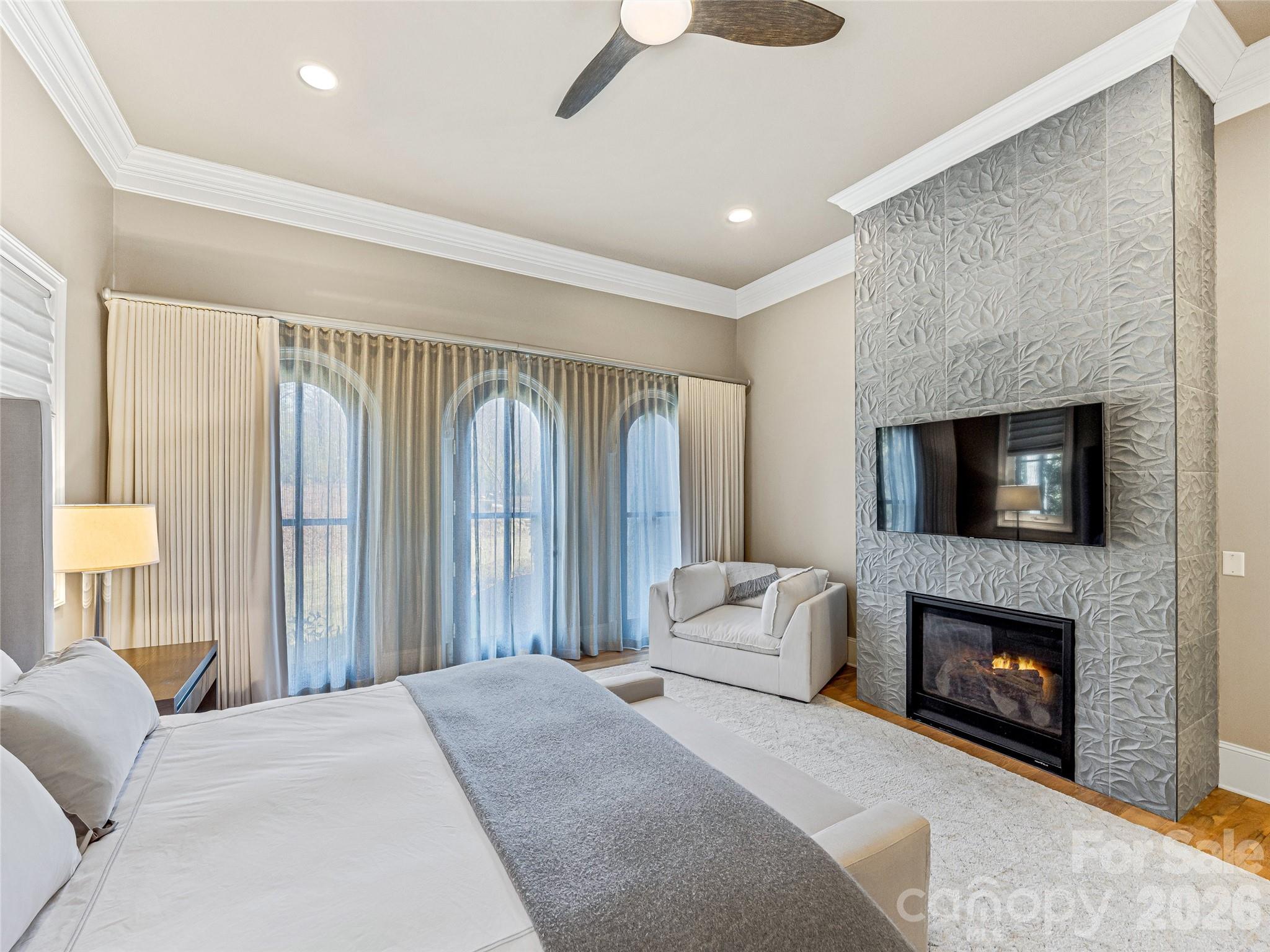 Primary Bedroom - Gas Fireplace, Custom Tile Surround, Electric Black Out Window Treatments - 1905 White Tree Trail, Arden