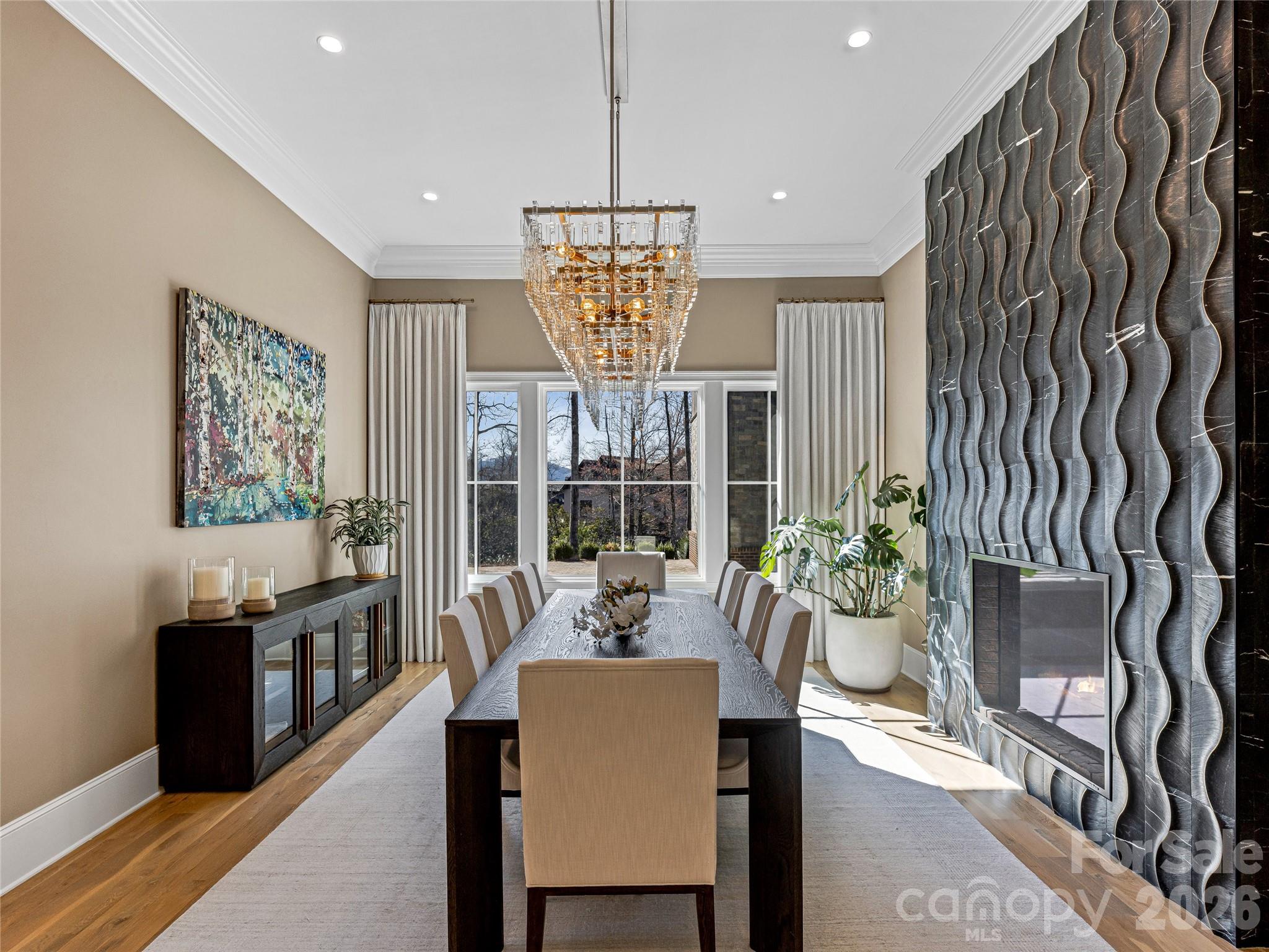 Dining Room with custom chandelier & see through fireplace - 1905 White Tree Trail, Arden