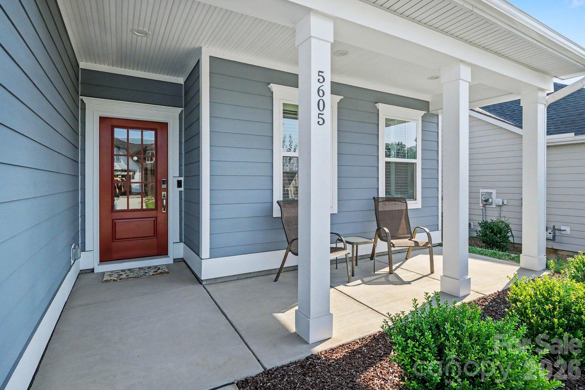 Inviting front covered porch - 5605 Caneel Lane, Denver