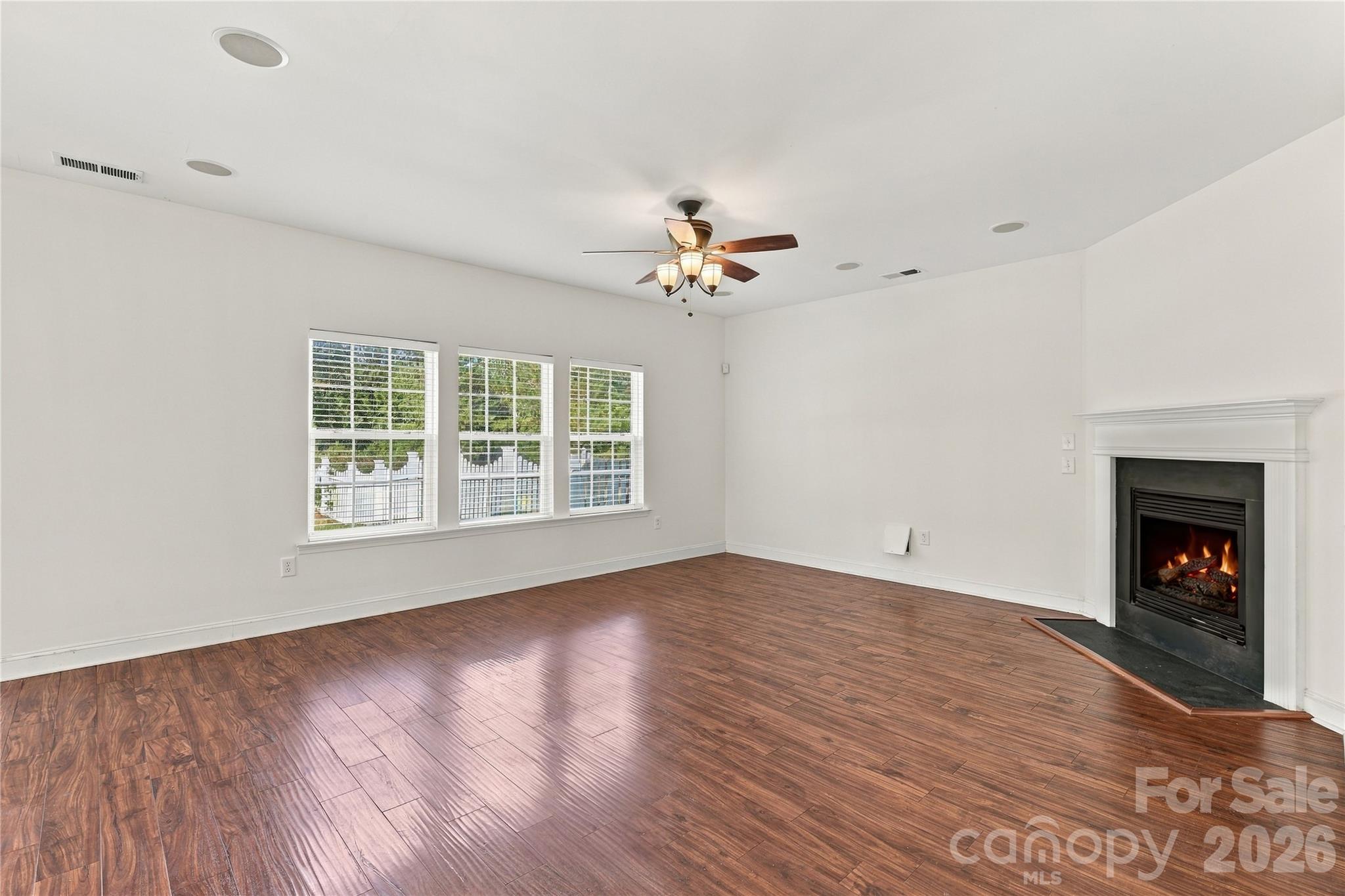 Picture cozy evenings by the fireplace in this sun-filled living room. - 327 Annaberg Lane, Monroe