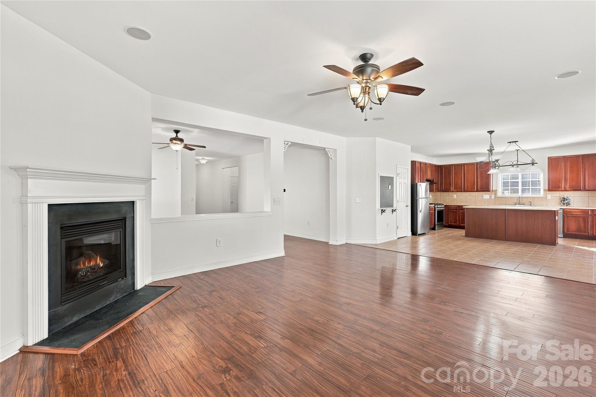 The living room opens to the kitchen, so you're always part of the conversation. - 327 Annaberg Lane, Monroe