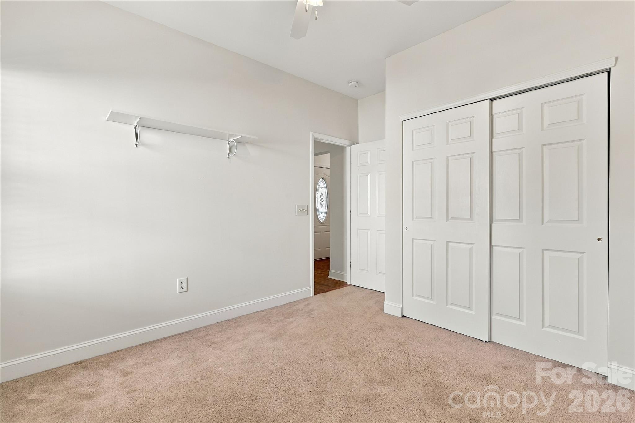 This bedroom has a double-door closet and a flexible layout. It could be a guest room, office, or hobby space. - 327 Annaberg Lane, Monroe