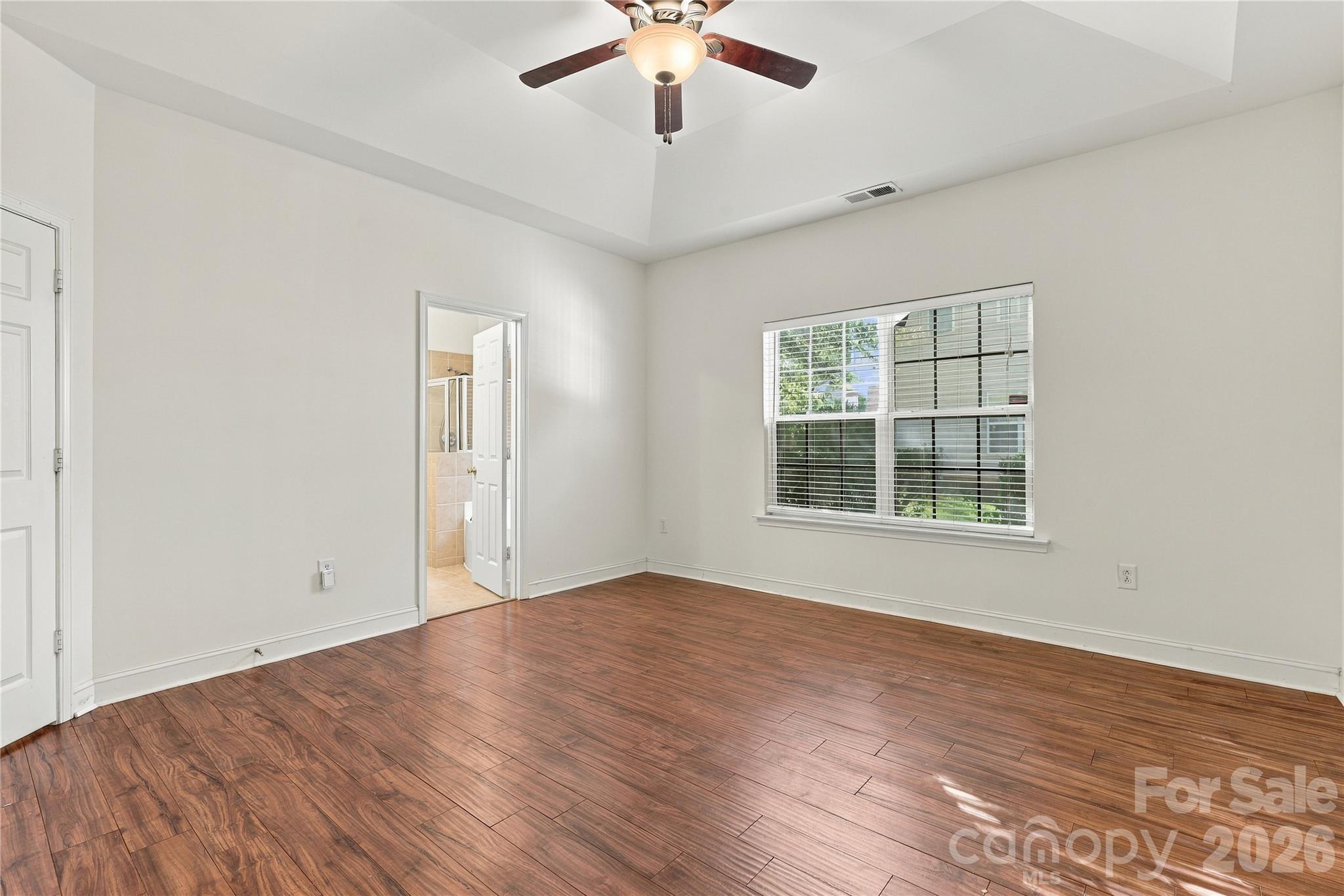 There's room for a king-size bed and a sitting area in this relaxing primary retreat. - 327 Annaberg Lane, Monroe