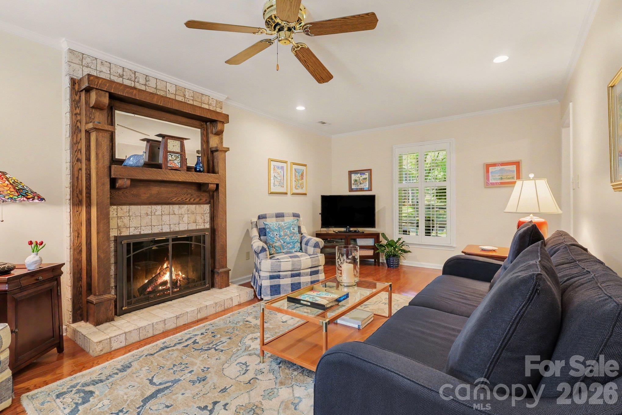 Comfortable living room. Please note, fire shown in fireplace is virtually added. - 640 Heather Lane, Charlotte