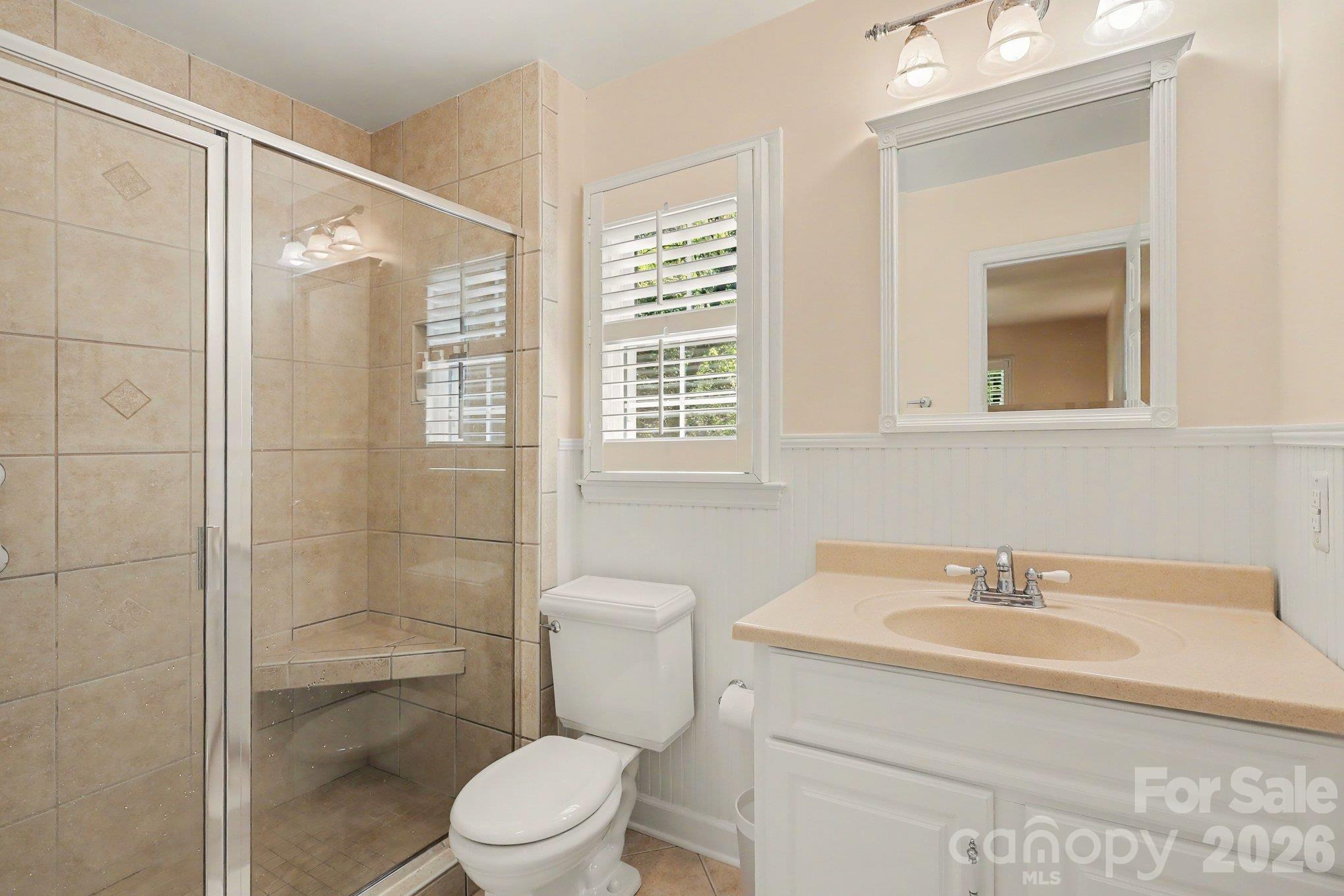 En suite primary bathroom with neutral finishes. - 640 Heather Lane, Charlotte