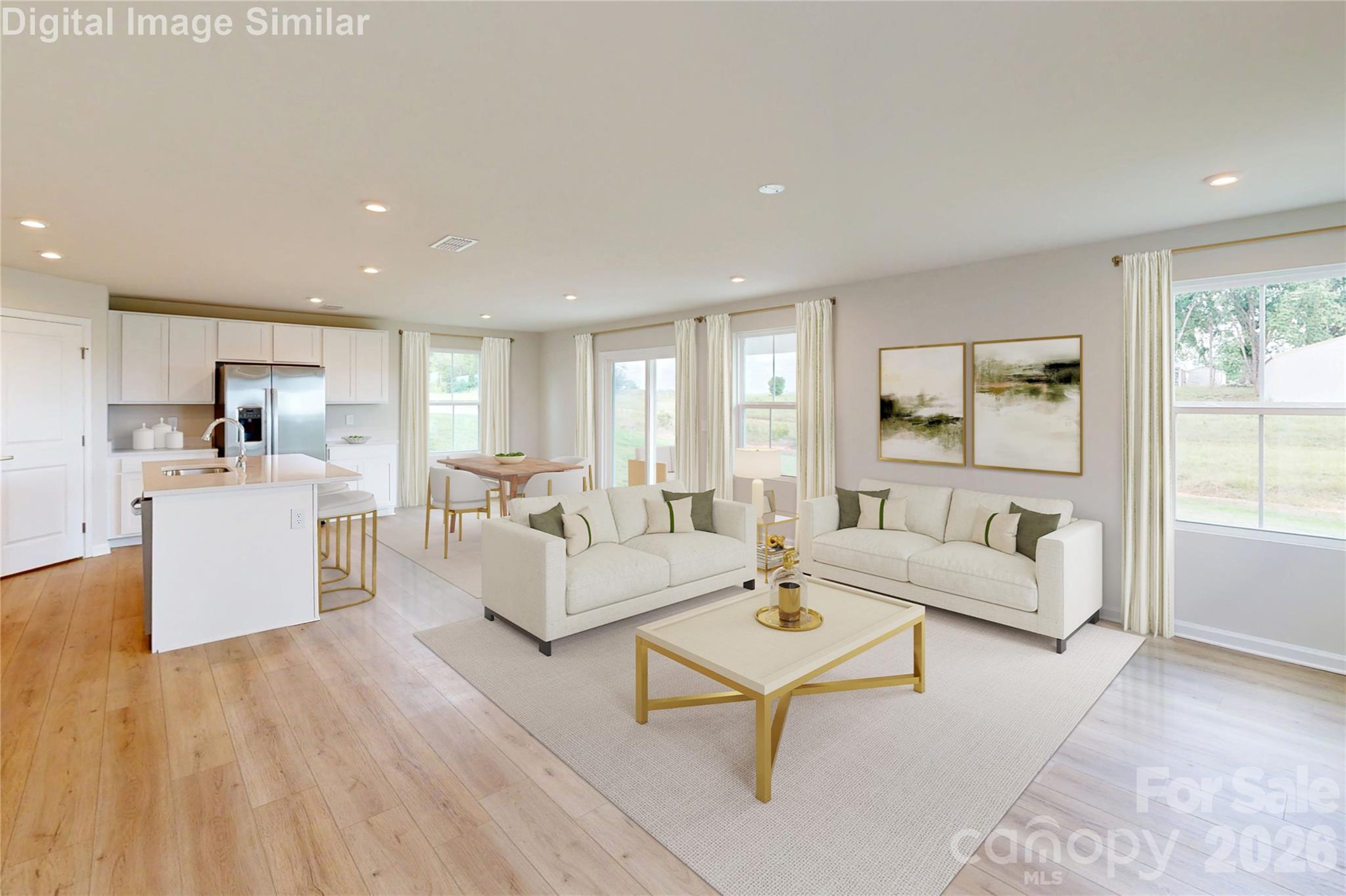 Flooded with natural light from large windows, this cozy open-concept space flows effortlessly from the kitchen to the dining area. Whether hosting friends or enjoying quiet family time, the airy layout creates the perfect setting to relax, connect, and feel at home. - 833 E Liberty Street, China Grove