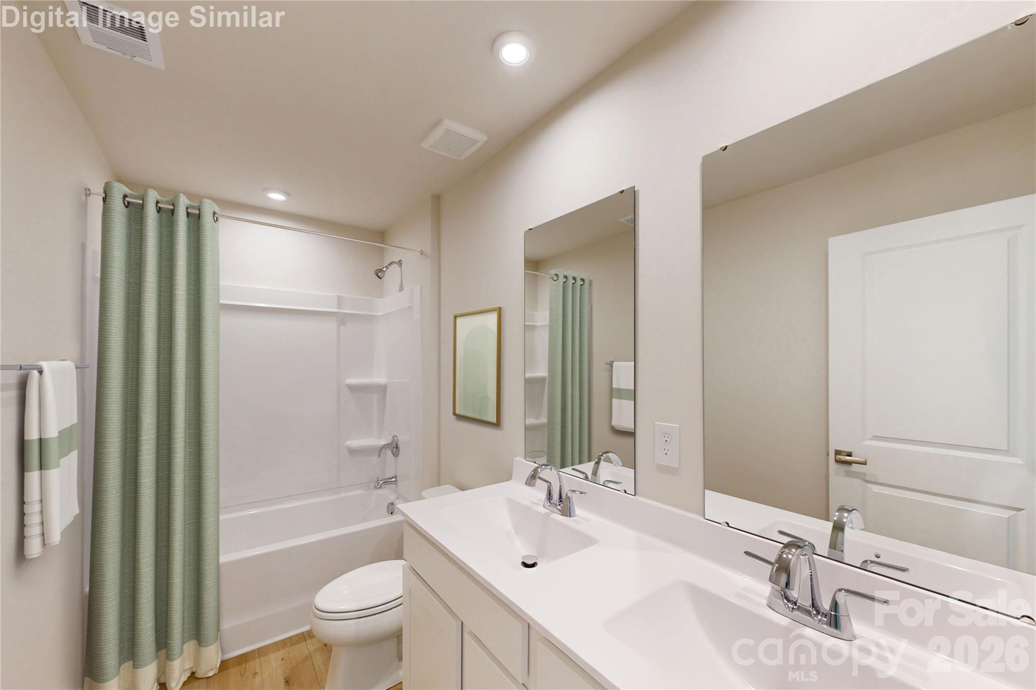 This guest bath blends fun and function! The tub is perfect for splashy playtime or a relaxing soak, while dual vanities and mirrors make busy mornings a breeze. With plenty of cabinet storage, it’s stylish, spacious, and ready to handle daily life with ease. - 833 E Liberty Street, China Grove