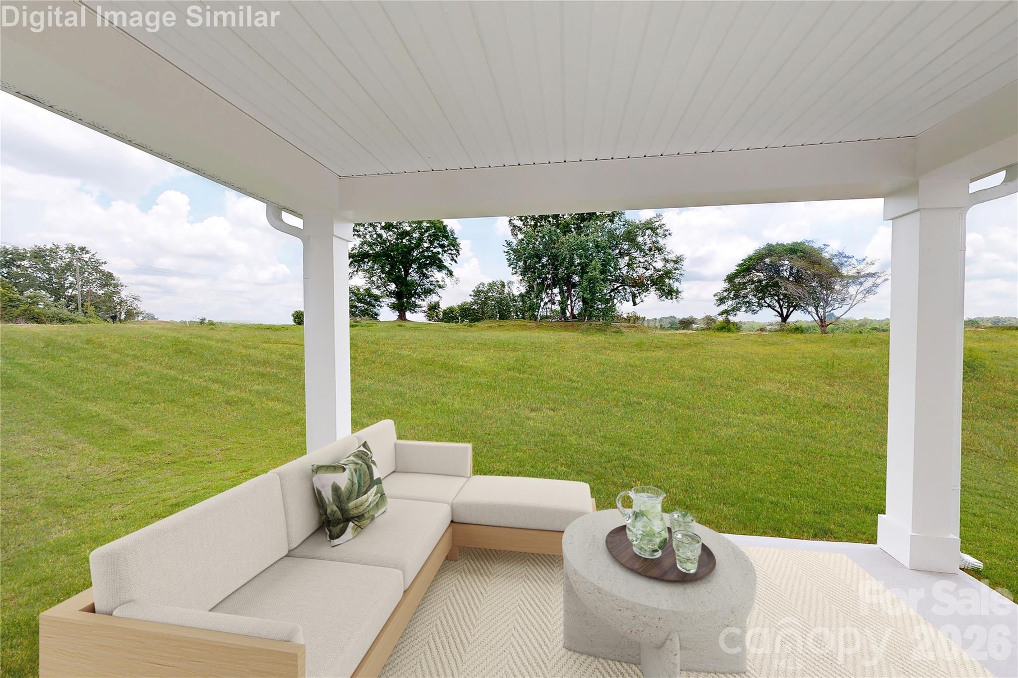 This optional covered porch is the perfect outdoor escape! Whether you're relaxing with a book, watching the kids play, or hosting casual gatherings, it offers comfort, shade, and charm. A versatile space that extends your living area and invites you to unwind. - 833 E Liberty Street, China Grove