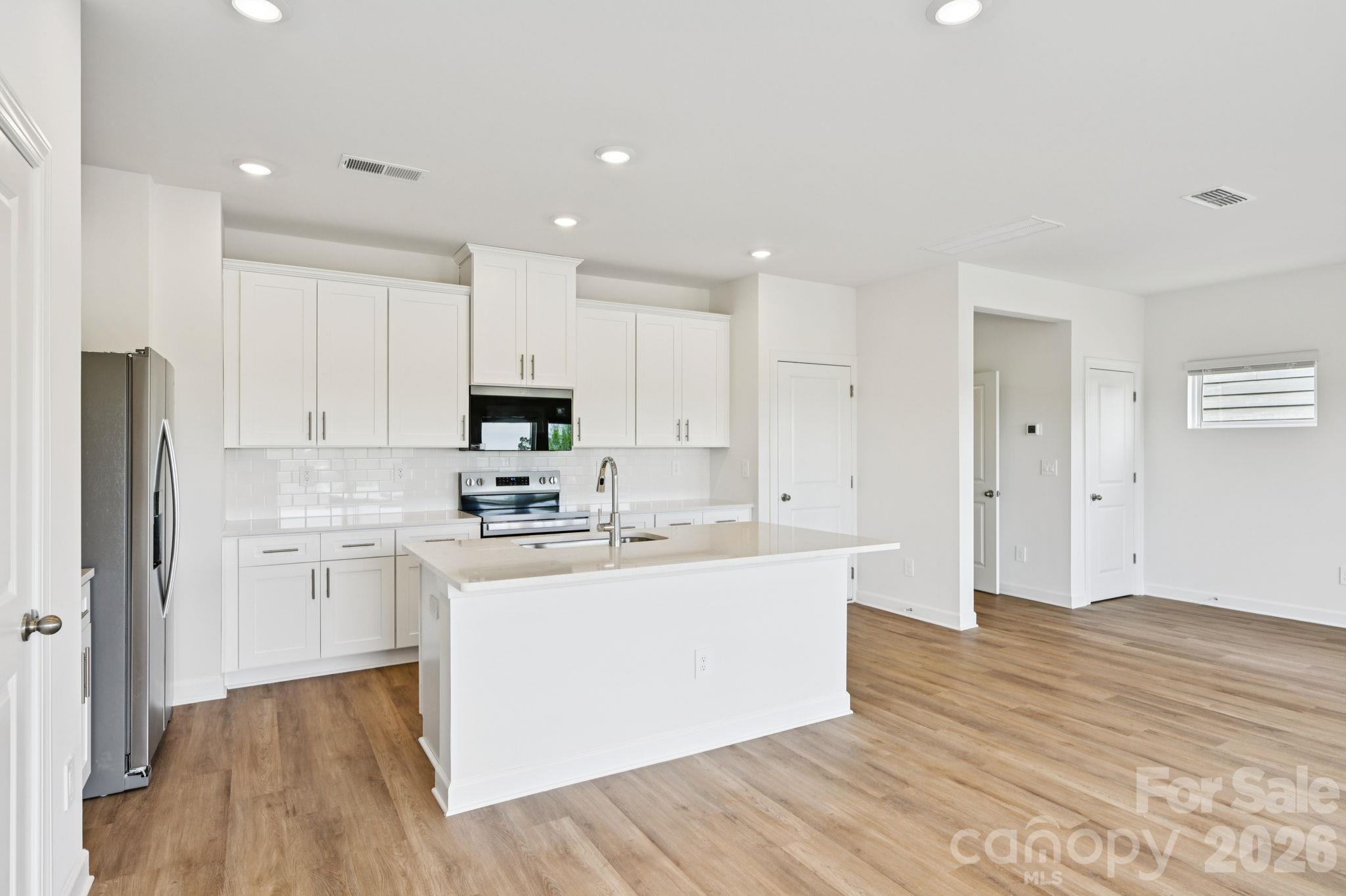 Photo is not of the actual home, but is an inspirational photo of builder’s model home and may depict options, furnishings, and/or decorator features that are not included - 1440 Wildflower Street, Newton