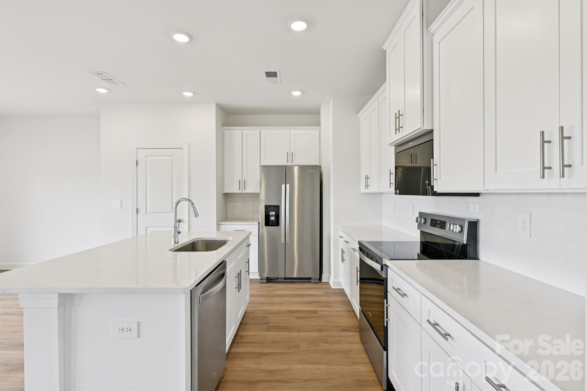 Photo is not of the actual home, but is an inspirational photo of builder’s model home and may depict options, furnishings, and/or decorator features that are not included - 1440 Wildflower Street, Newton