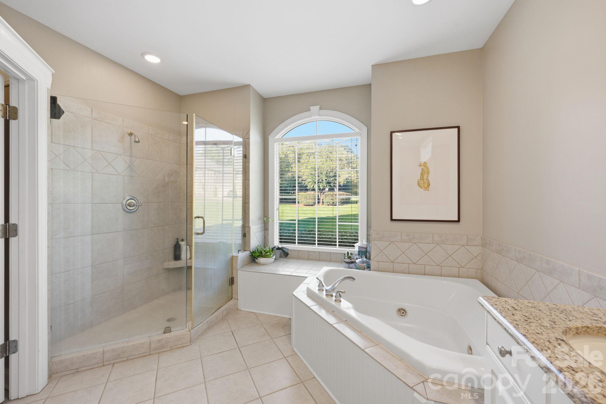 Tiled Shower and Jacuzzi Tub in Primary Bath - 105 Kings Crest Drive, Mooresville