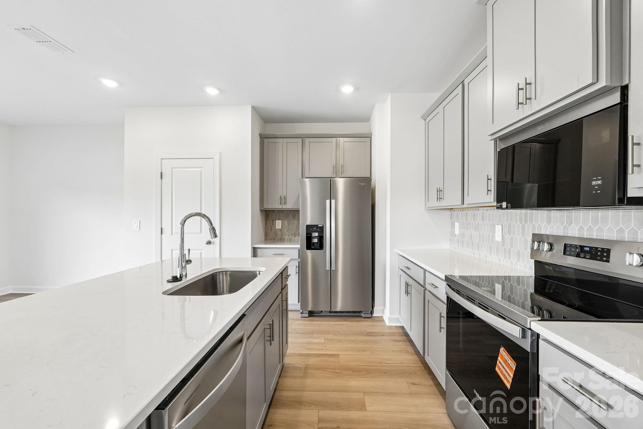 Photo is not of the actual home, but is an inspirational photo of builder’s model home and may depict options, furnishings, and/or decorator features that are not included - 12548 Russellwood Lane, Charlotte