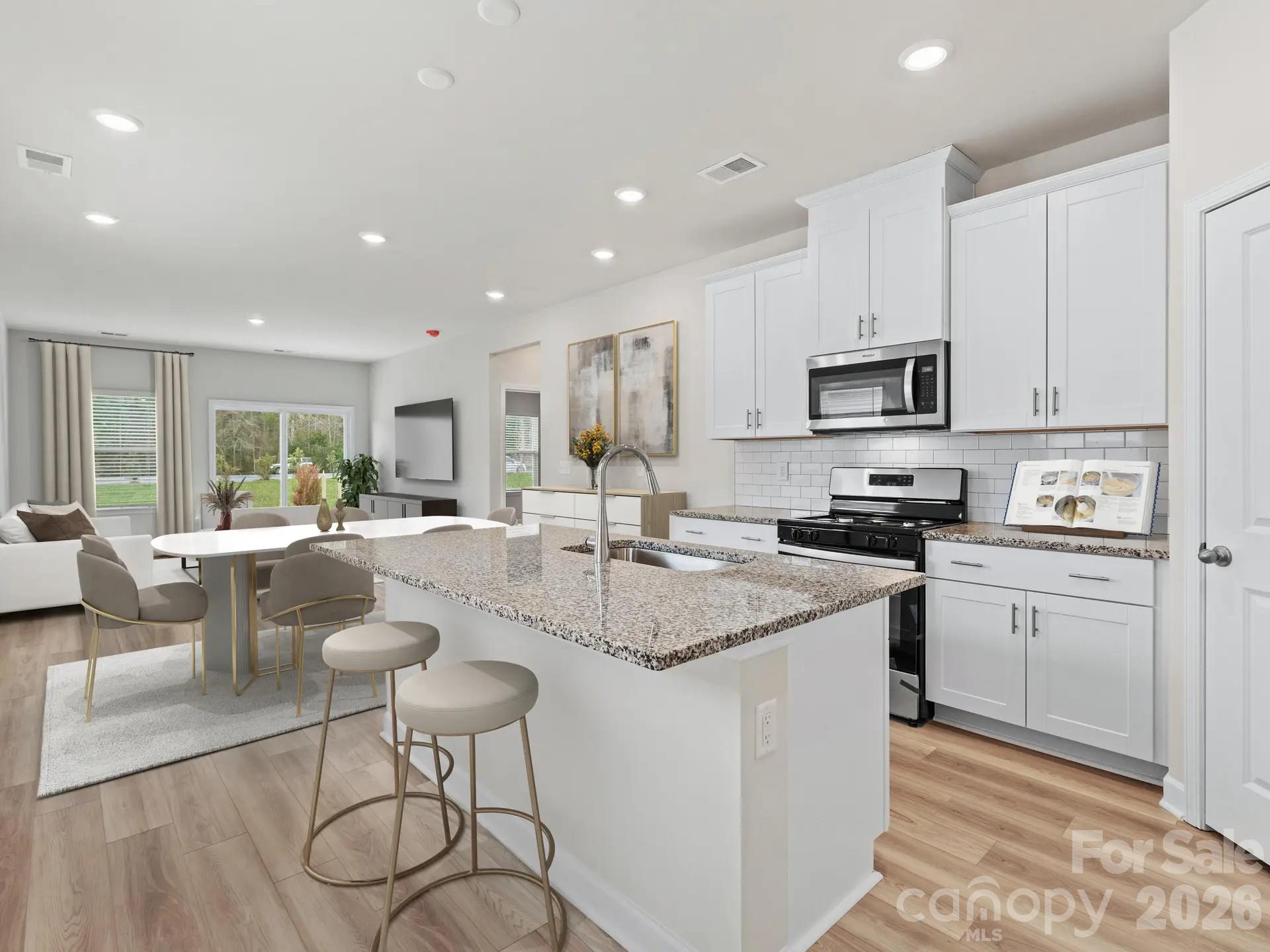 Photo is not of the actual home, but is an inspirational photo of builder’s model home and may depict options, furnishings, and/or decorator features that are not included - 12523 Russellwood Lane, Charlotte