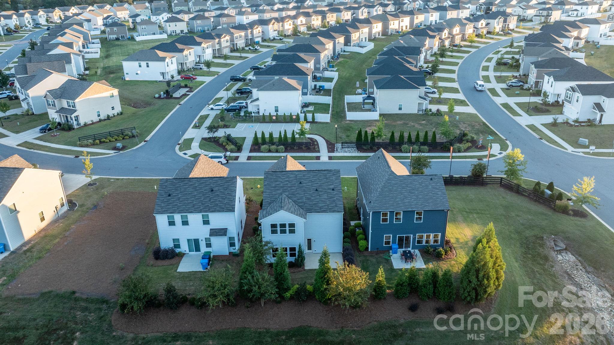 This home is located very near to the entrance of the community for quick trips in and out. It is the middle home on the bottom row of the picture - 1023 Freeman View Drive, Albemarle