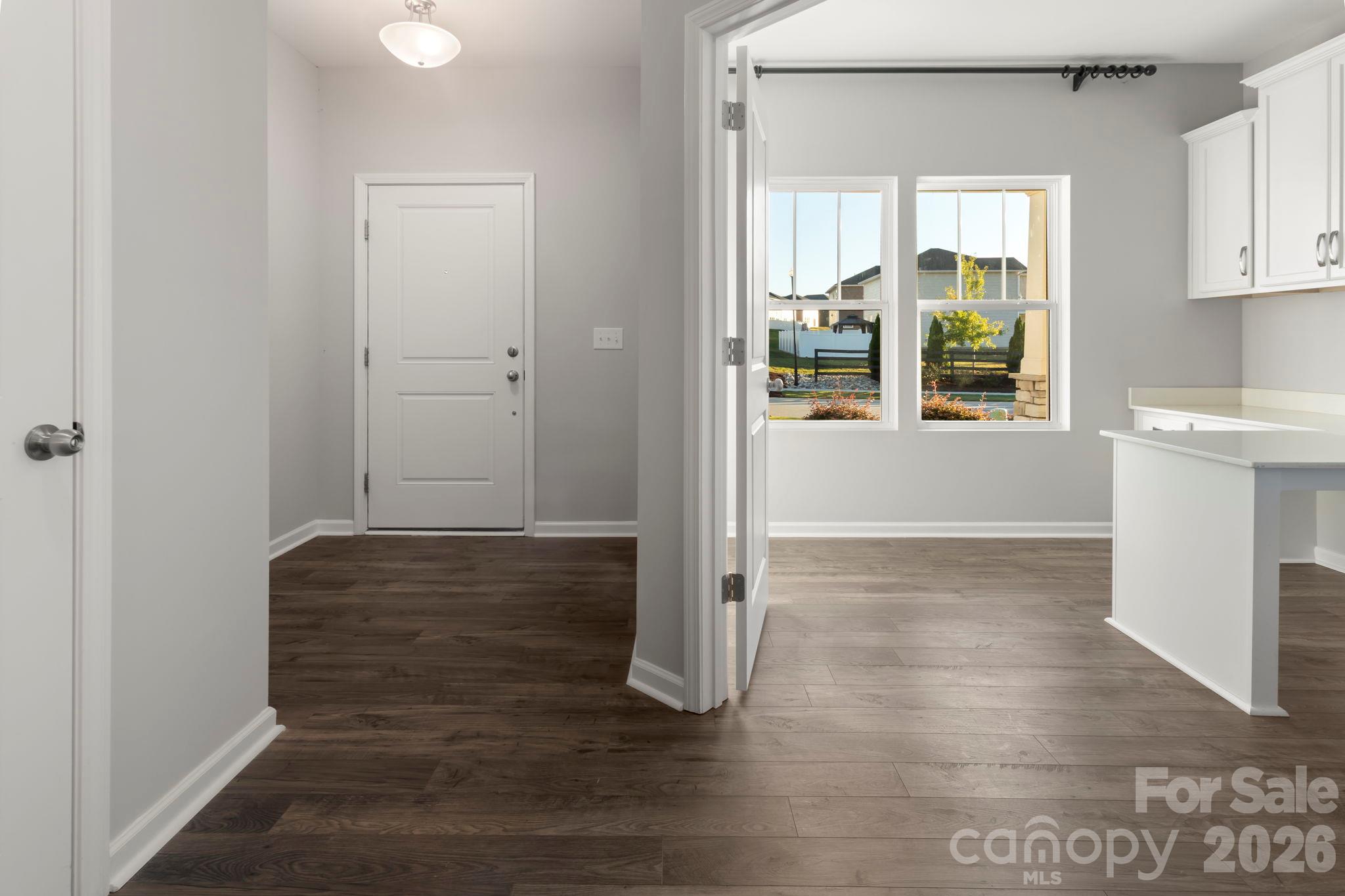 View of foyer and office or study with built in desks and cabinets - 1023 Freeman View Drive, Albemarle