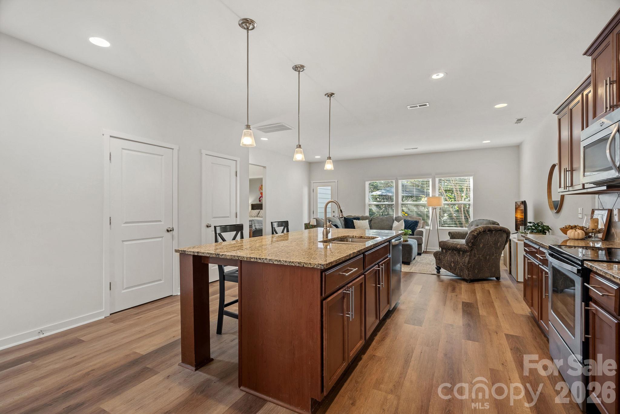 Spacious Kitchen Island with pendant lighting and recessed lighting - 13326 Pierre Reverdy Drive, Davidson