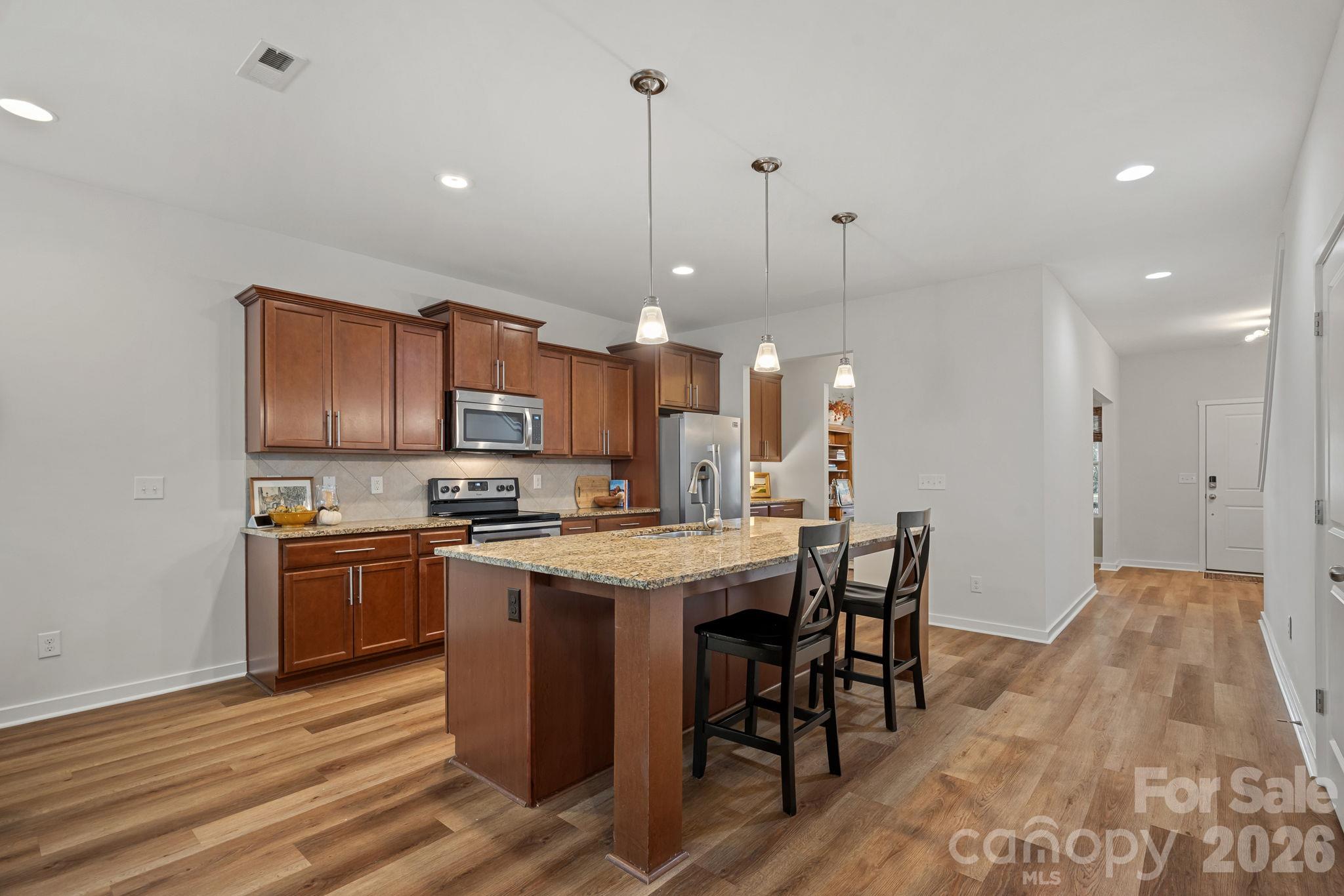 Abundant cabinetry, stainless appliances - 13326 Pierre Reverdy Drive, Davidson