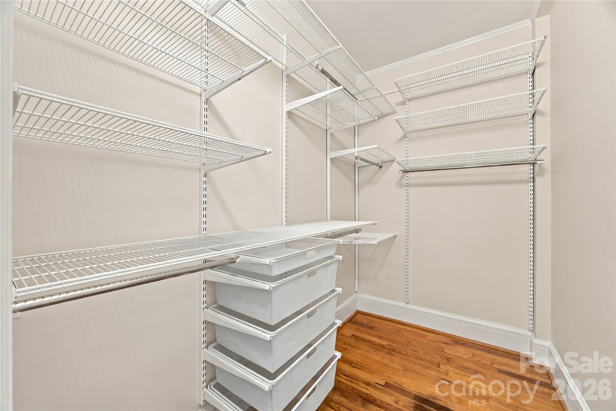 Walk-in Closet - Big on space, smart on organization - this unusually large walk-in features an Elfa system, while storage throughout the condo lets your wardrobe have it all to itself. - 712 Louise Avenue, Charlotte