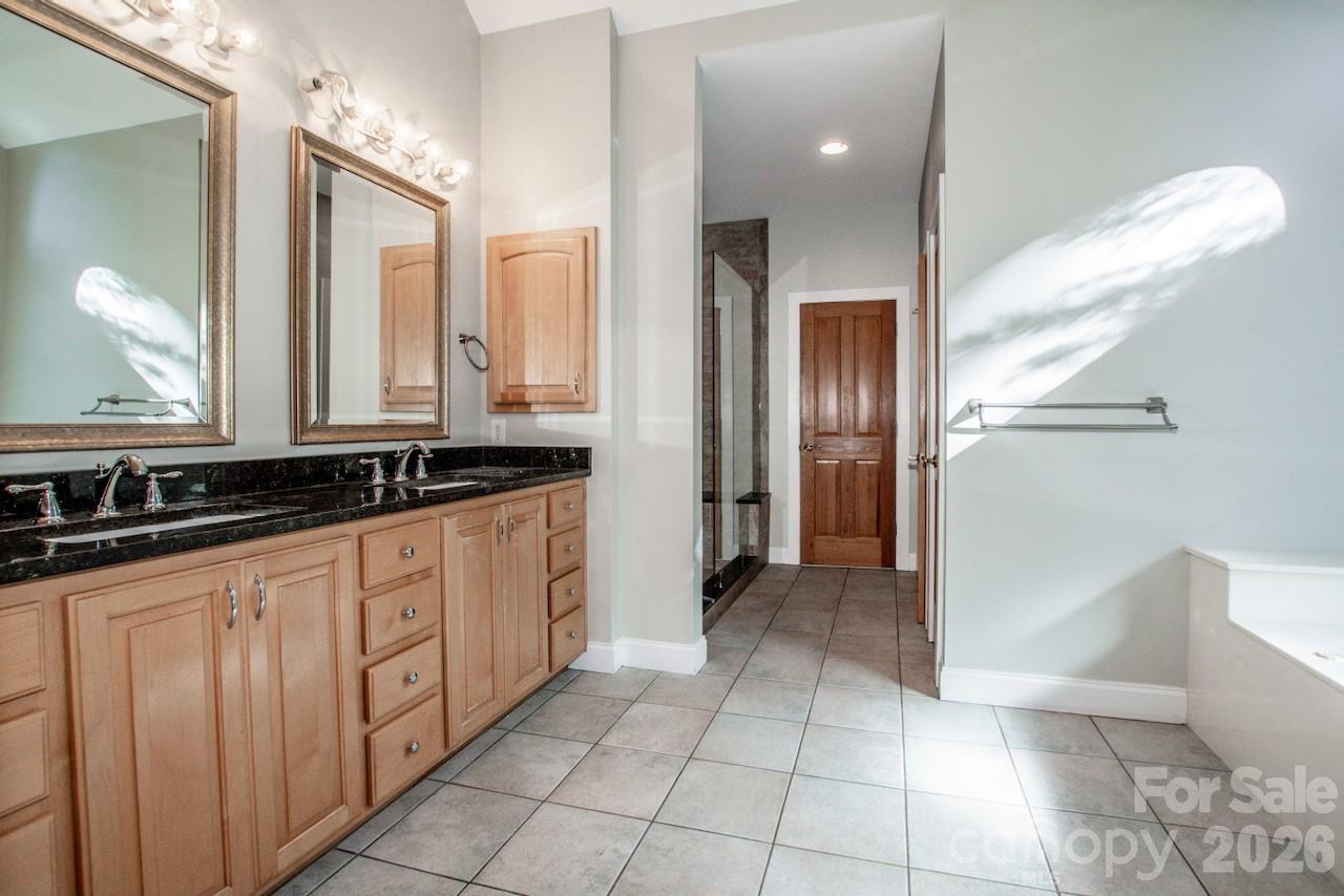 Primary bath with dual sinks and tile flooring - 351 Catalina Drive, Mooresville